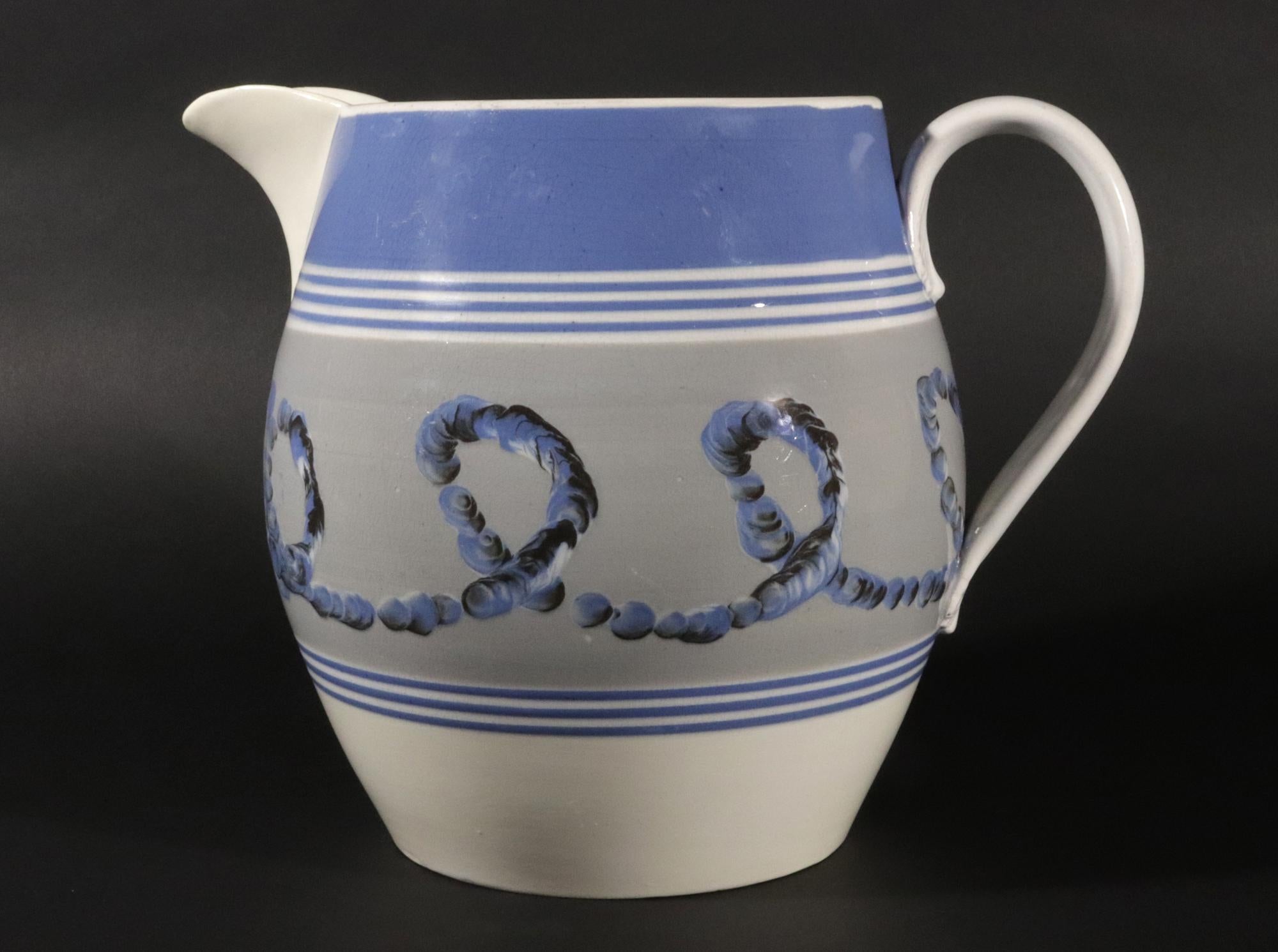 Large English Pearlware Mocha Earthworm Jug,
Staffordshire or Northern England,
Circa 1810-20.

A handsome and generously proportioned example of English Mocha ware, this pearlware jug displays the bold, abstract decoration that made the style so