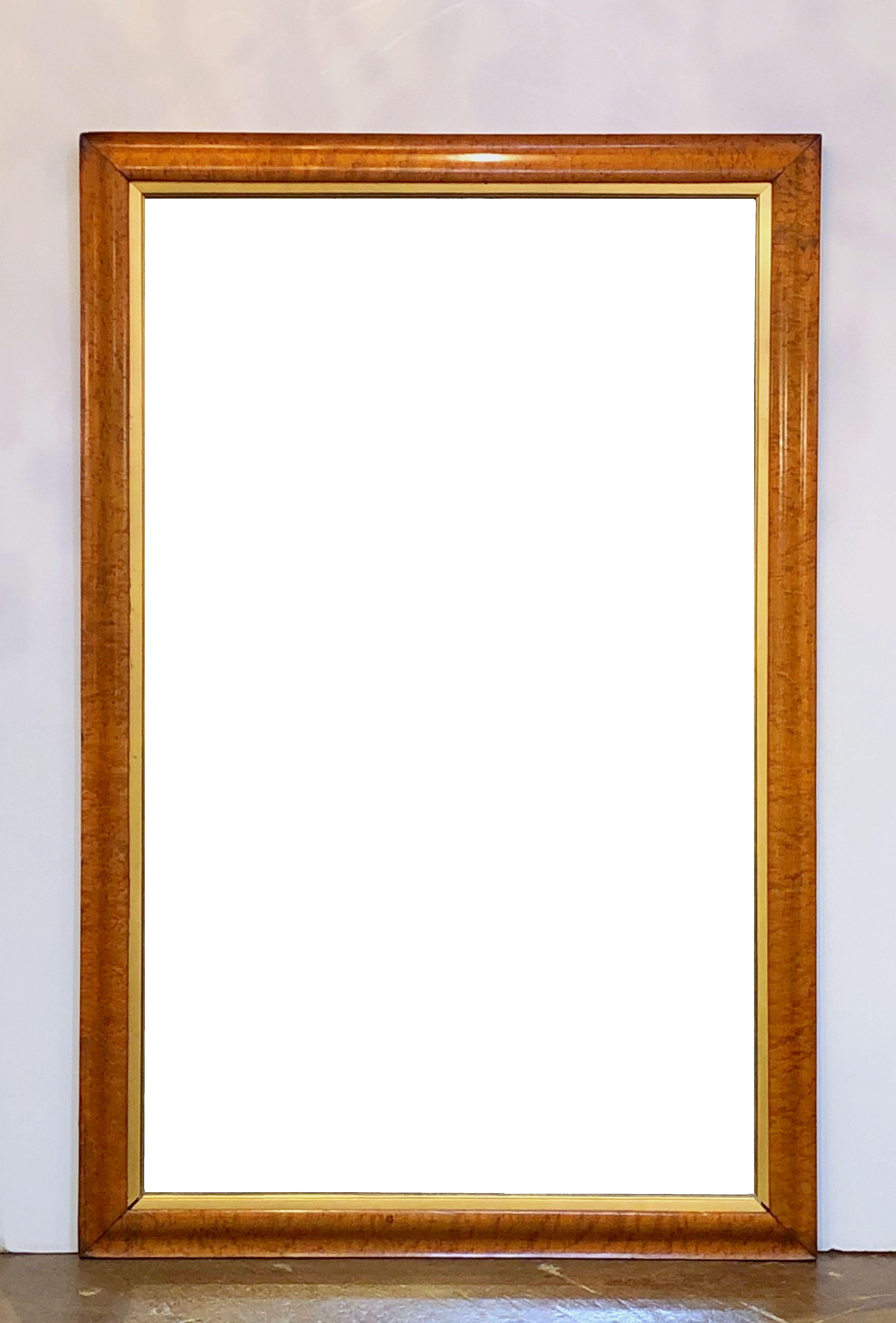 A Fine English large rectangular mirror featuring a bird’s-eye or curly maple frame with a gilt-wood 'slip' around the inner moulding.

Ready for display - vertically or horizontally.

Dimensions: Height 54 3/8 inches x Width 35 3/4 inches x Depth 1