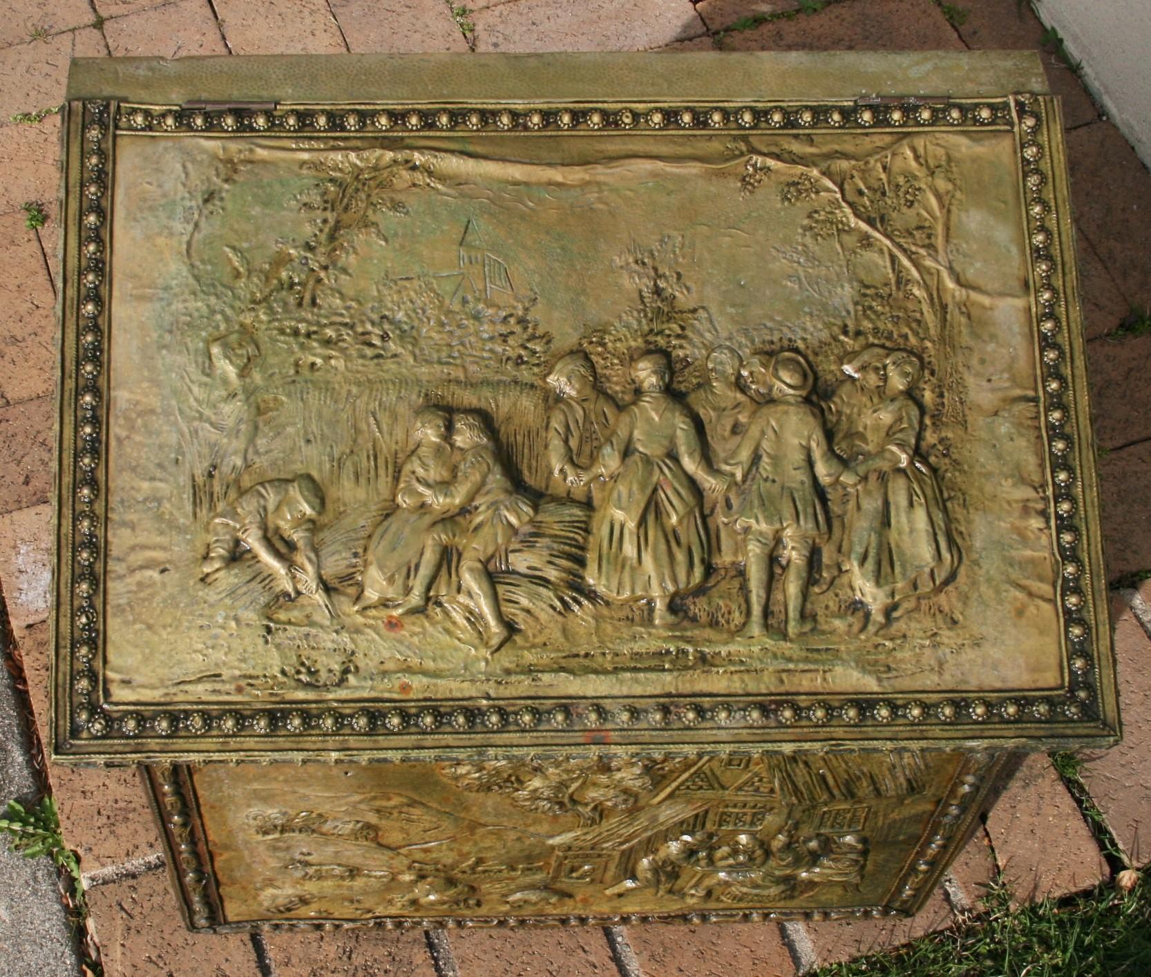 3-477 English brass covered wood box with scenes of English country side and tavern scenes on all sides
Originally used for wood/coal  storage now can be used for multiple storage uses.