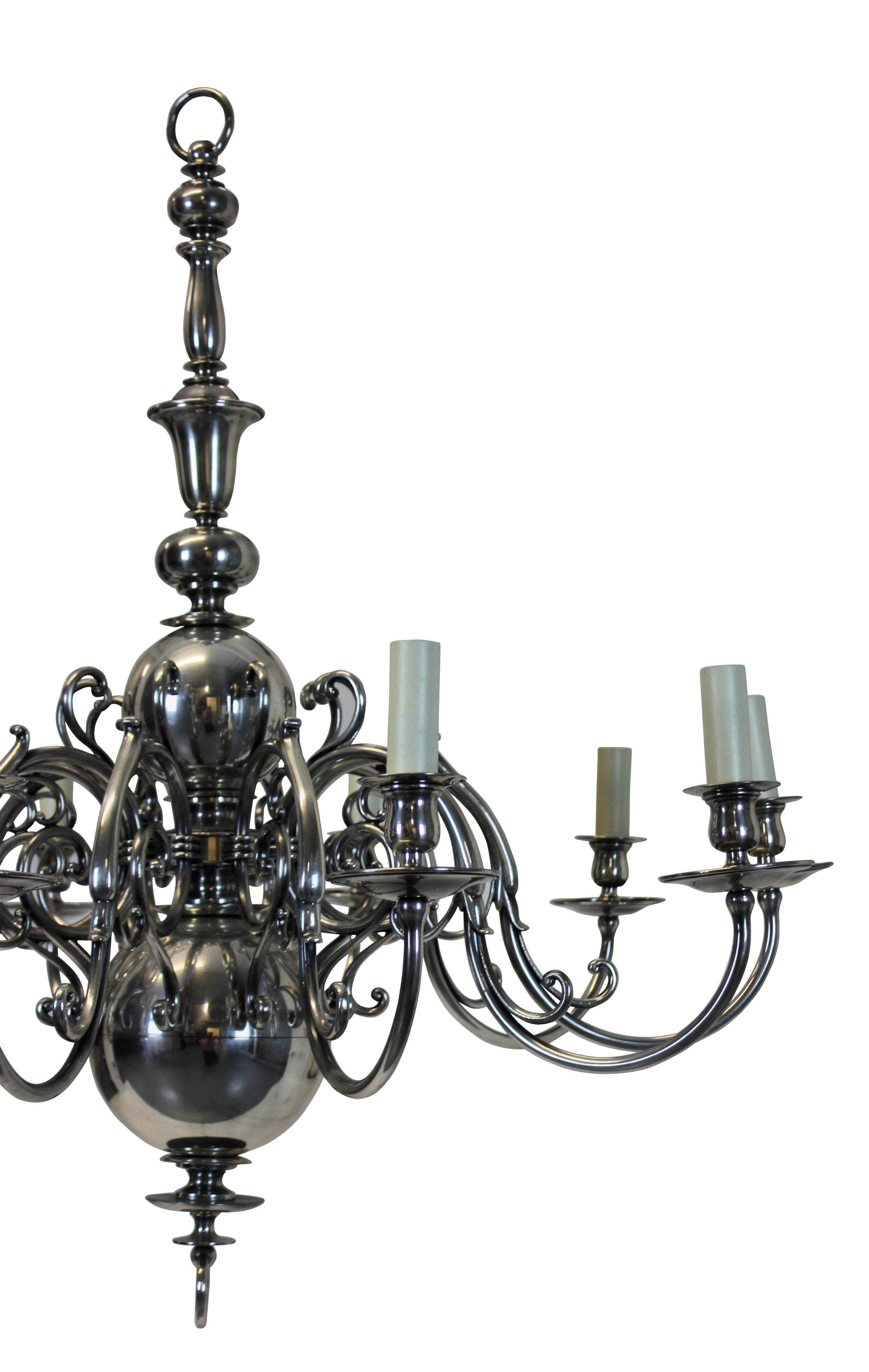 A large English silver plated chandelier with ten scrolled arms, with matching chain and canopy.
 