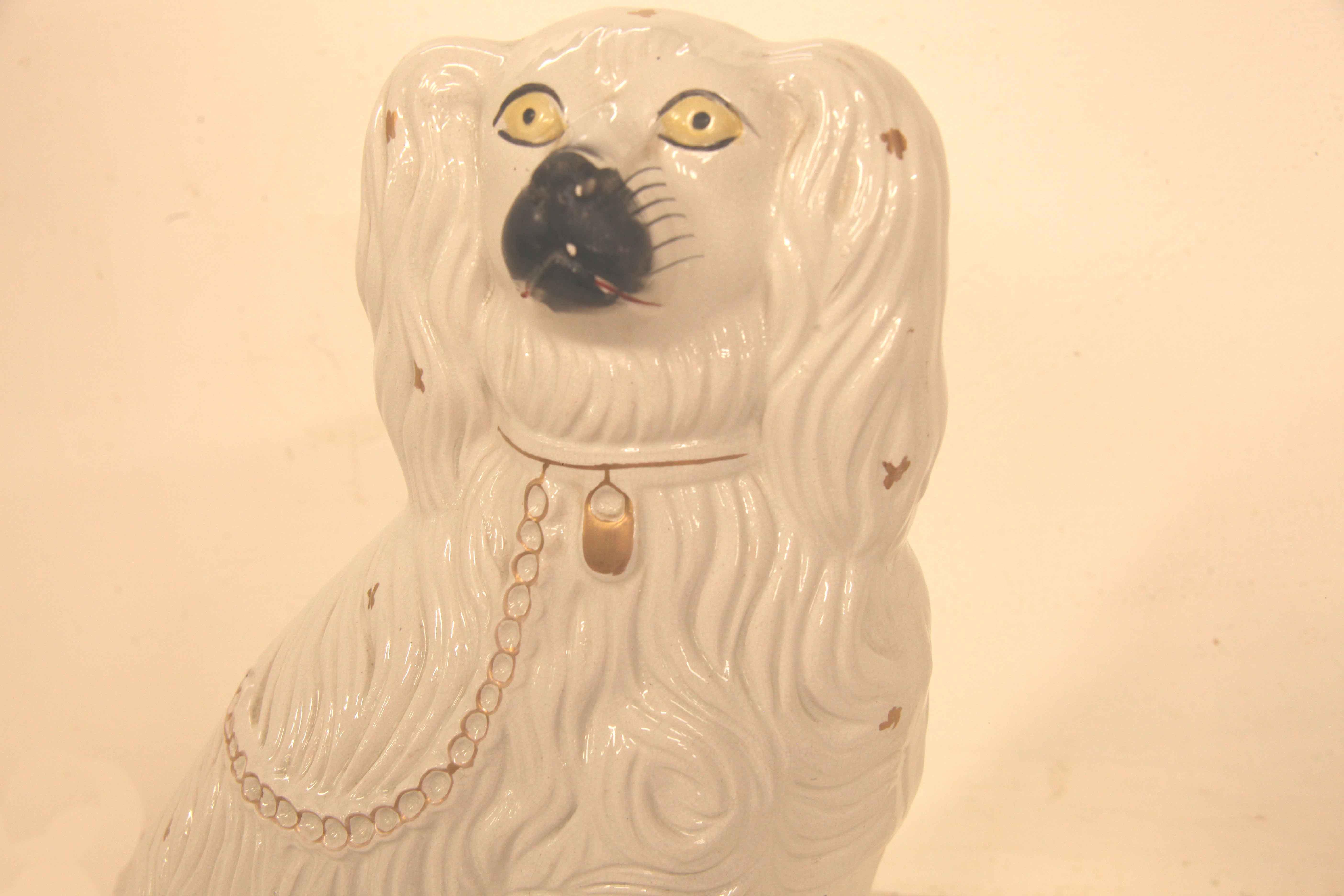 Large Staffordshire dog , this single dog is in very good condition,  his coat is in high relief, gold chain and locket. 