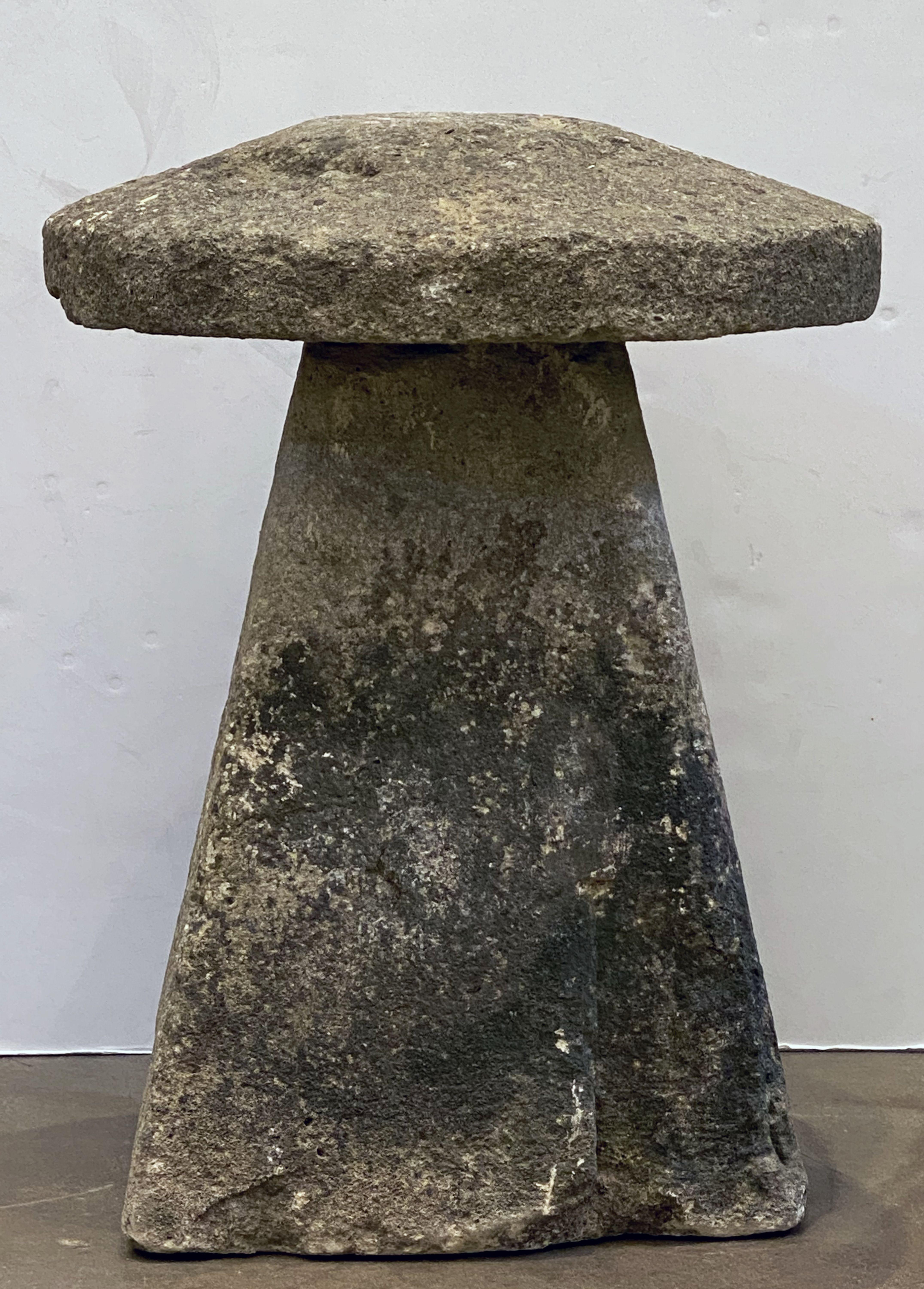 A steddle or staddle stone from the West Country of England, featuring a conical base mounted with a mushroom-shaped cap of quarried stone.

Use outdoors or indoors to create a contemporary or rustic English-garden effect. They are often used in