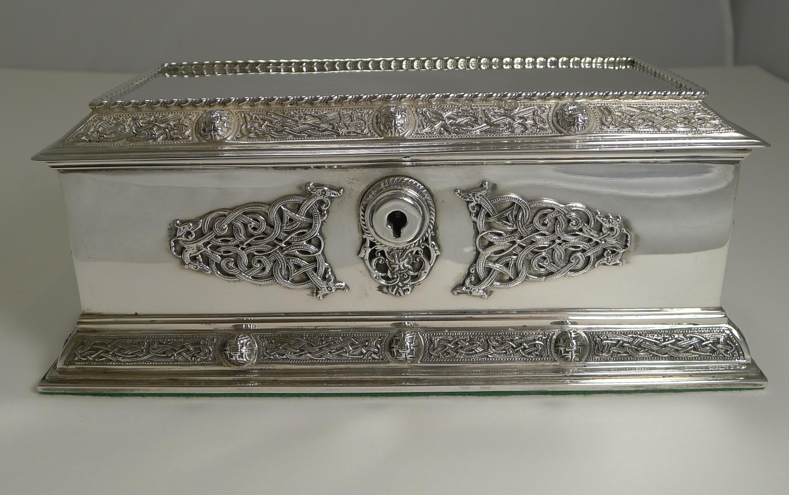 A truly grand and fine quality jewelry box made from English sterling silver with a full hallmark for London 1911. The makers mark is present for the top-notch silversmith, Elkington and Company.

The casket is adorned with the most exquisite and