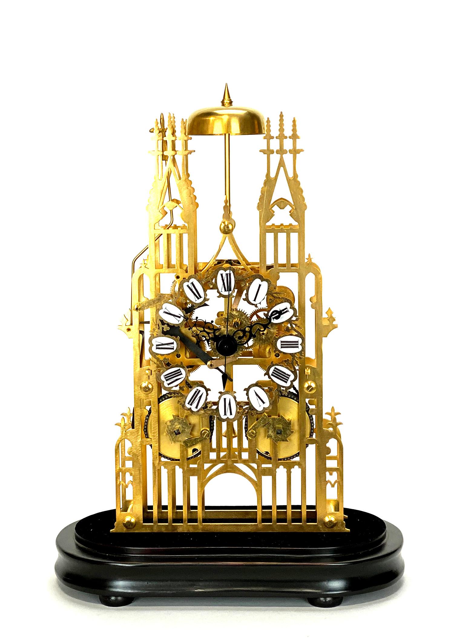 Large English Style Cathedral Crown Escapement Fusee Striking Skeleton Clock

Here is a very nice looking English style Cathedral form skeleton clock. It sits on a wooden base and protected under an oval glass dome. Both front and back plates have