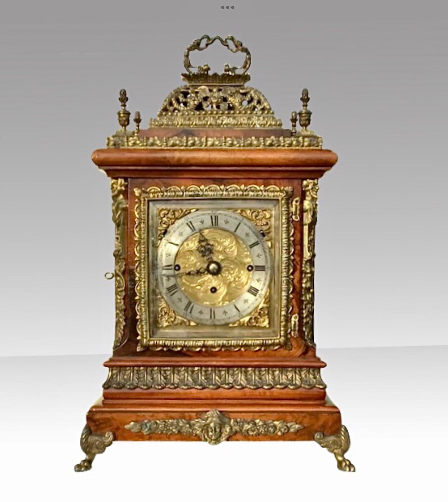 Magnificent English large basket top figured walnut triple fusee bracket boardroom musical clock,.
Decorated with brass filigree mounts that chimes the quarters and hours on a choice of 8 or 4 graduated bells.
(Also has chime silent