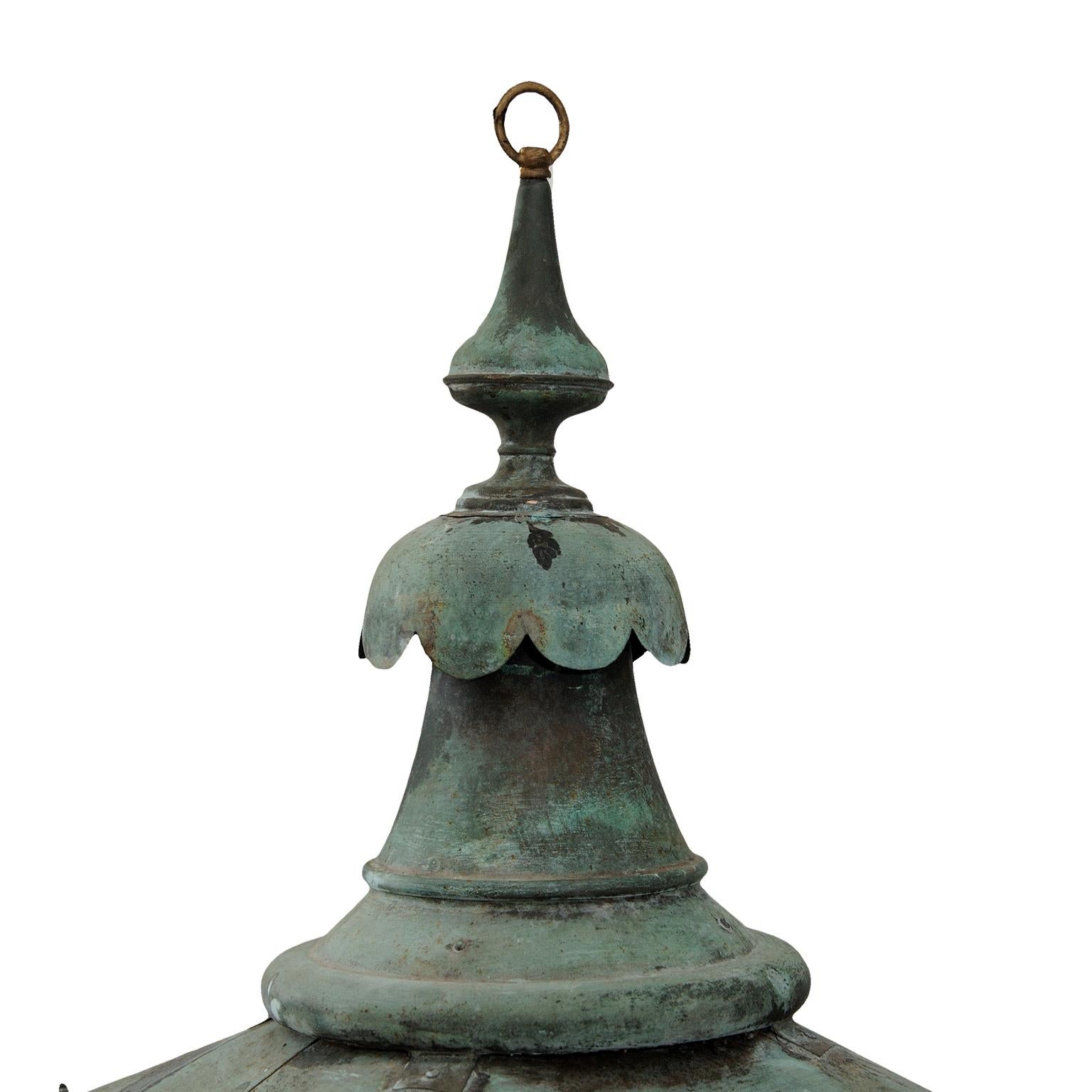 This is one of our stunning large mid-19th century English verdigris copper hanging Lanterns, now converted to electricity and PAT tested, suitable for interior or exterior use. Complete with lions paw feet and brass makers name plate, W.Parkinson &