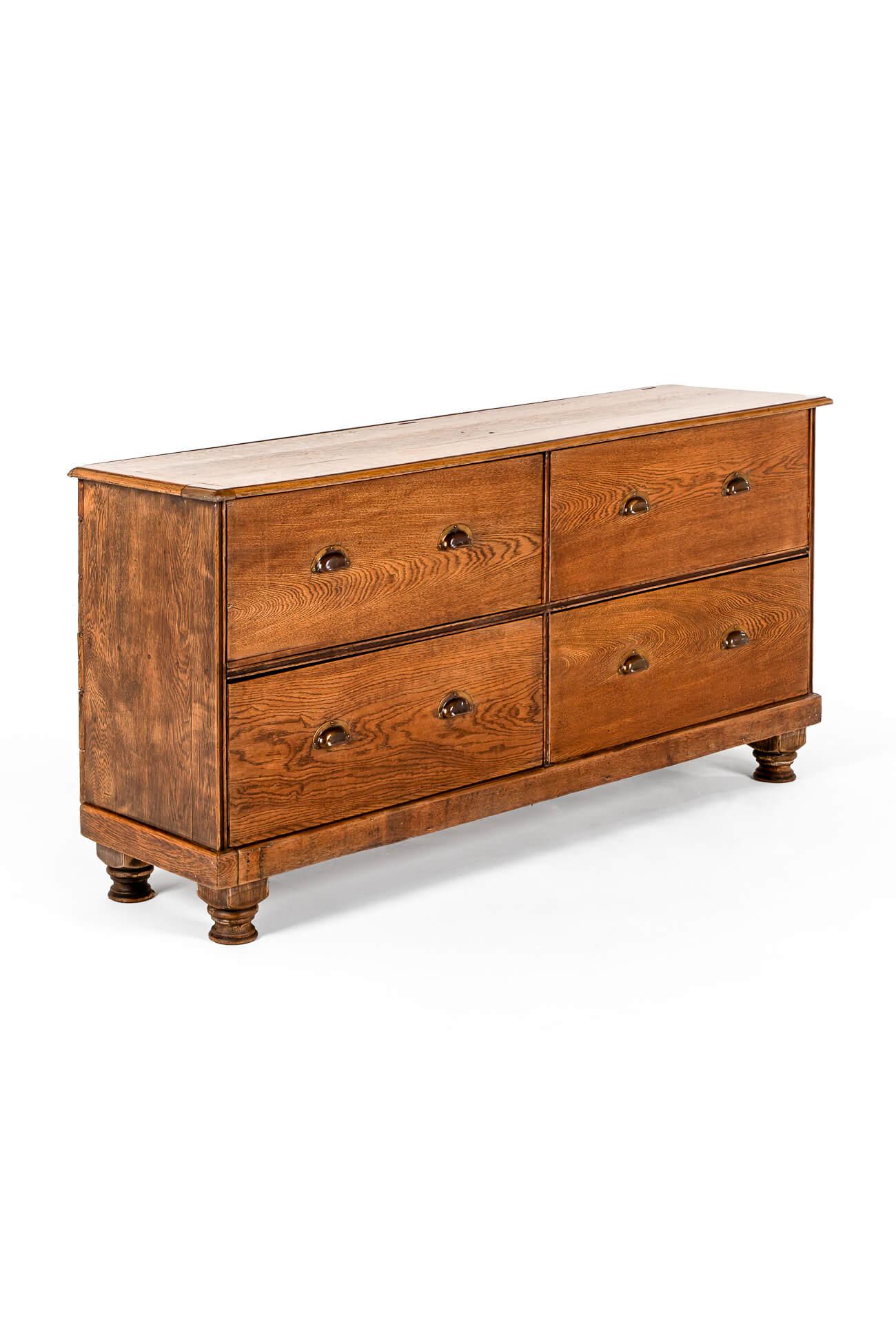 A large Victorian oak cabinet made of up of four deep  smooth running drawers.

Each drawer has two brass original brass cup handles perfect for maximum storage solutions.

The top is made of large thick oak plank’s with molded sides and cleated