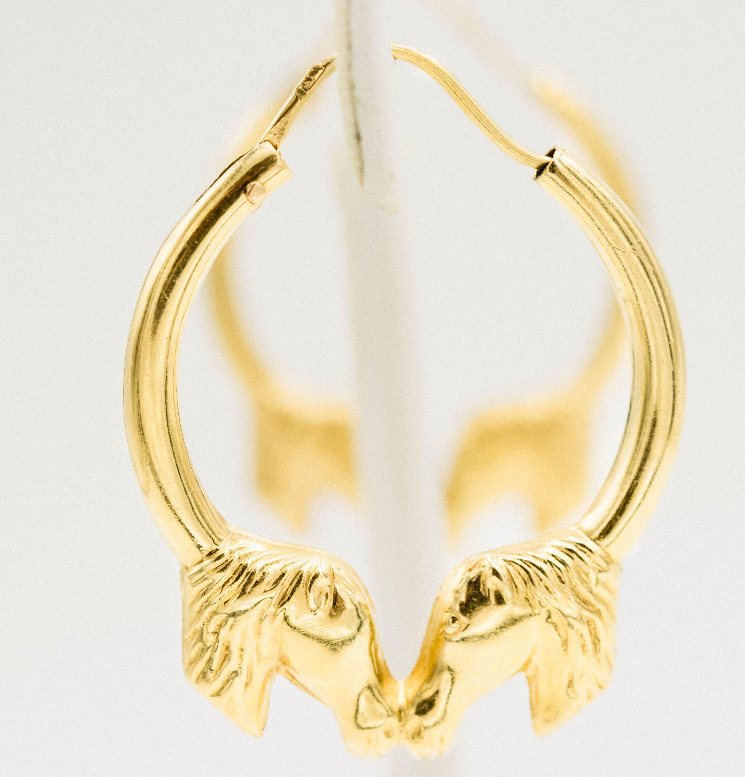 18k Yellow gold hoop earrings with two horses touching noses.  A perfect gift for an equestrian or just someone who loves horses. Marked 750 for 18k on the post.  They are lightweight so easy to wear.