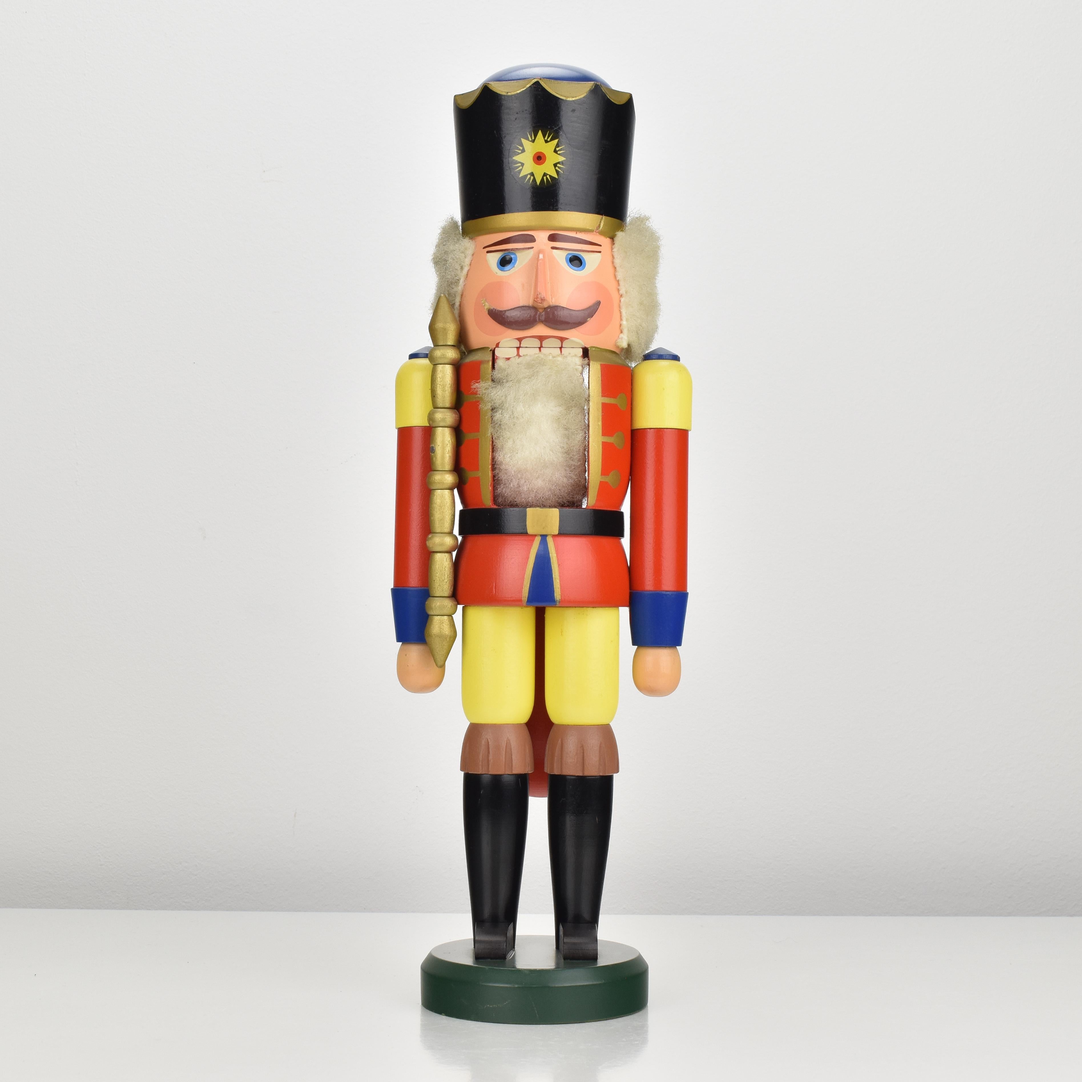 A vintage nutcracker from the Erzgebirge region, in shape of a king made of turned wood and painted in vibrant colors, dating back to the 1970s.
This large nutcracker showcases the intricate craftsmanship and traditional German design, reflecting