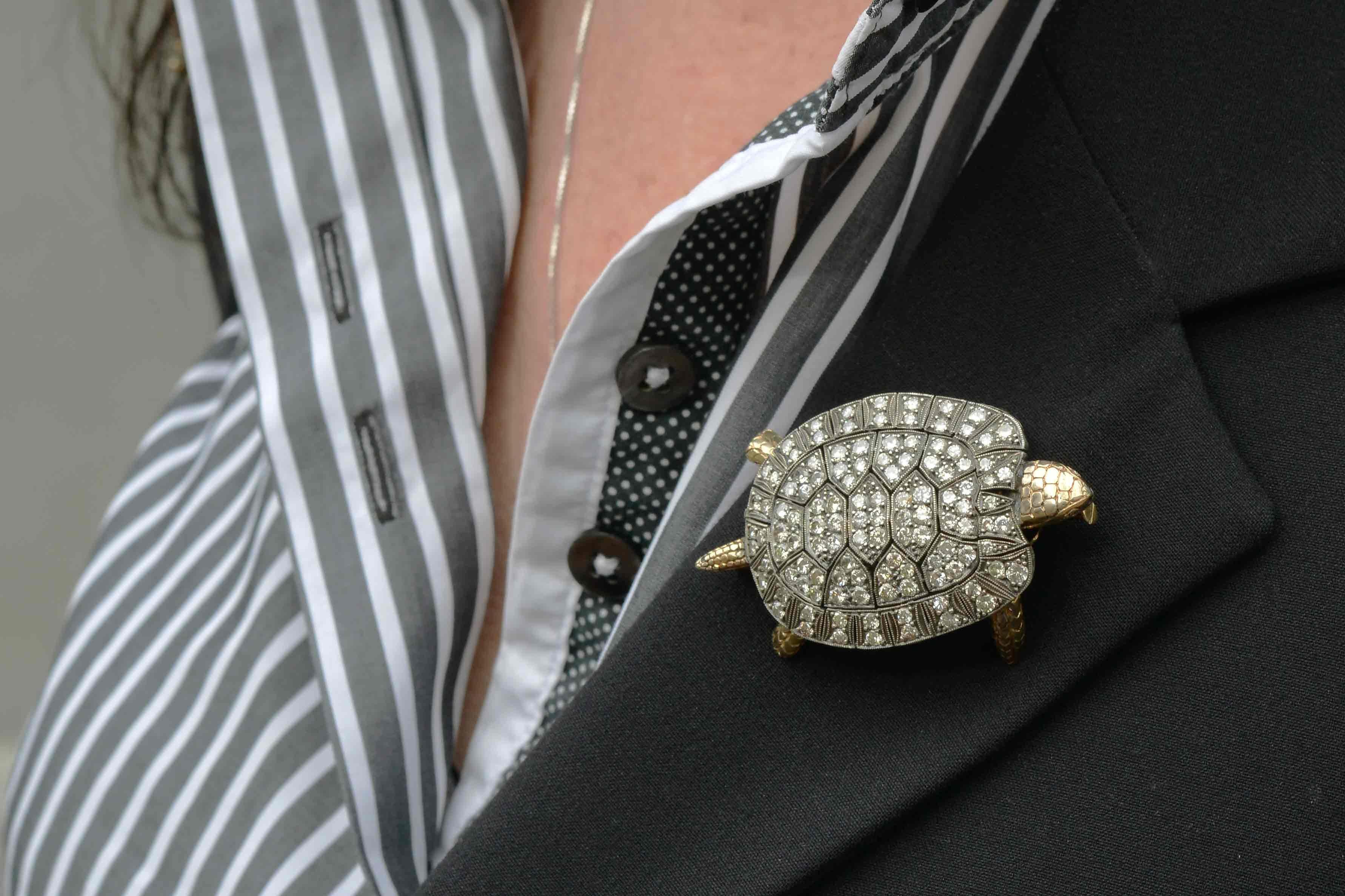 A most unusual and large turtle brooch bursting with a sparkling diamond encrusted shell. This extraordinary tortoise pin with 160 individually pave' set diamonds framed within highly detailed milgrain reserves. Hand made in the Victorian style with