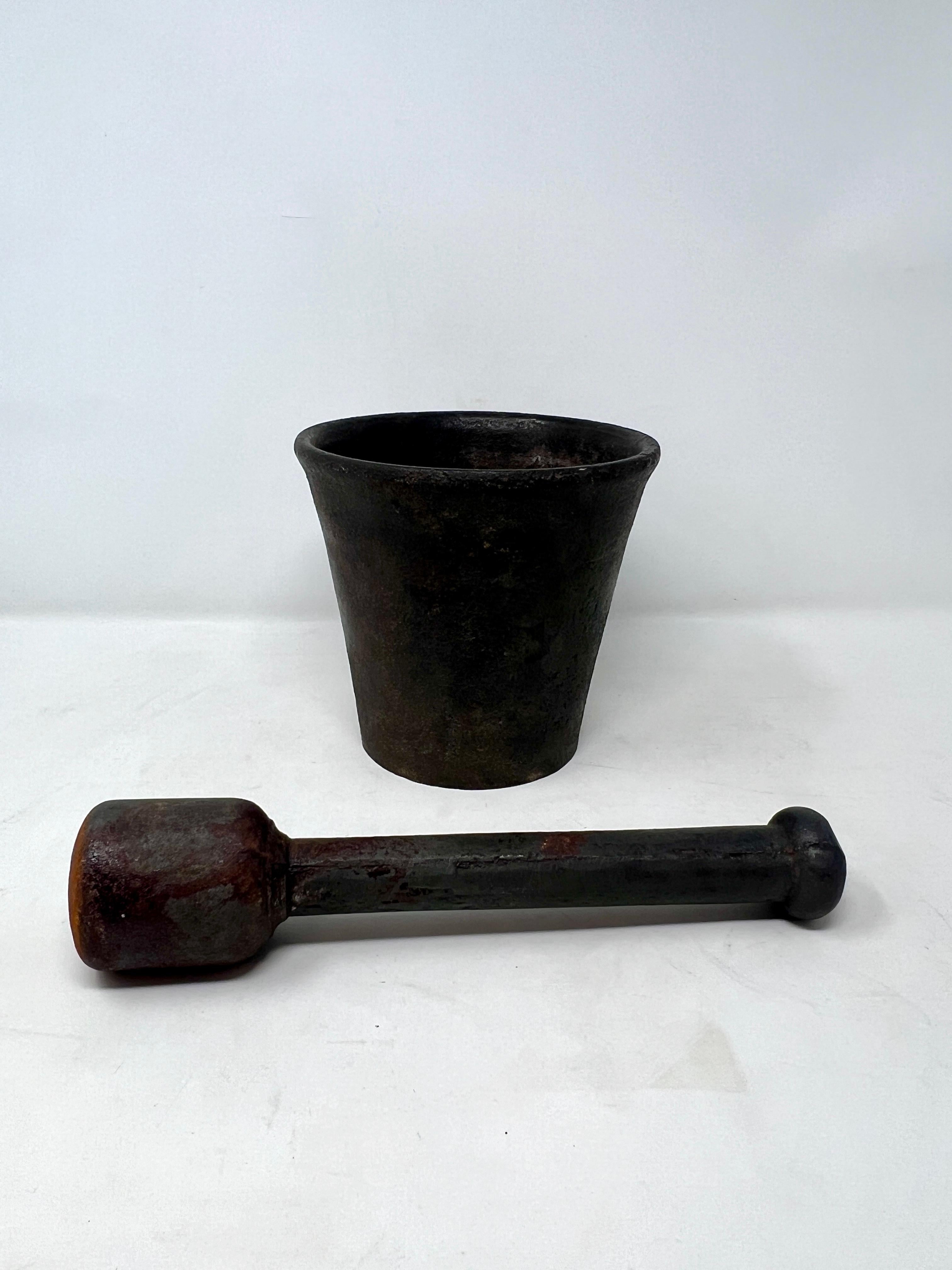 Large Estate Solid Iron Mortar And Pestle, Circa 1930's-1940's.  Very heavy and substantial piece.
Mortar
	H = 10.25 inches
	Dia = 6.5 inches
Pestle
	H = 10.25 inches
	Dia = 2 inches