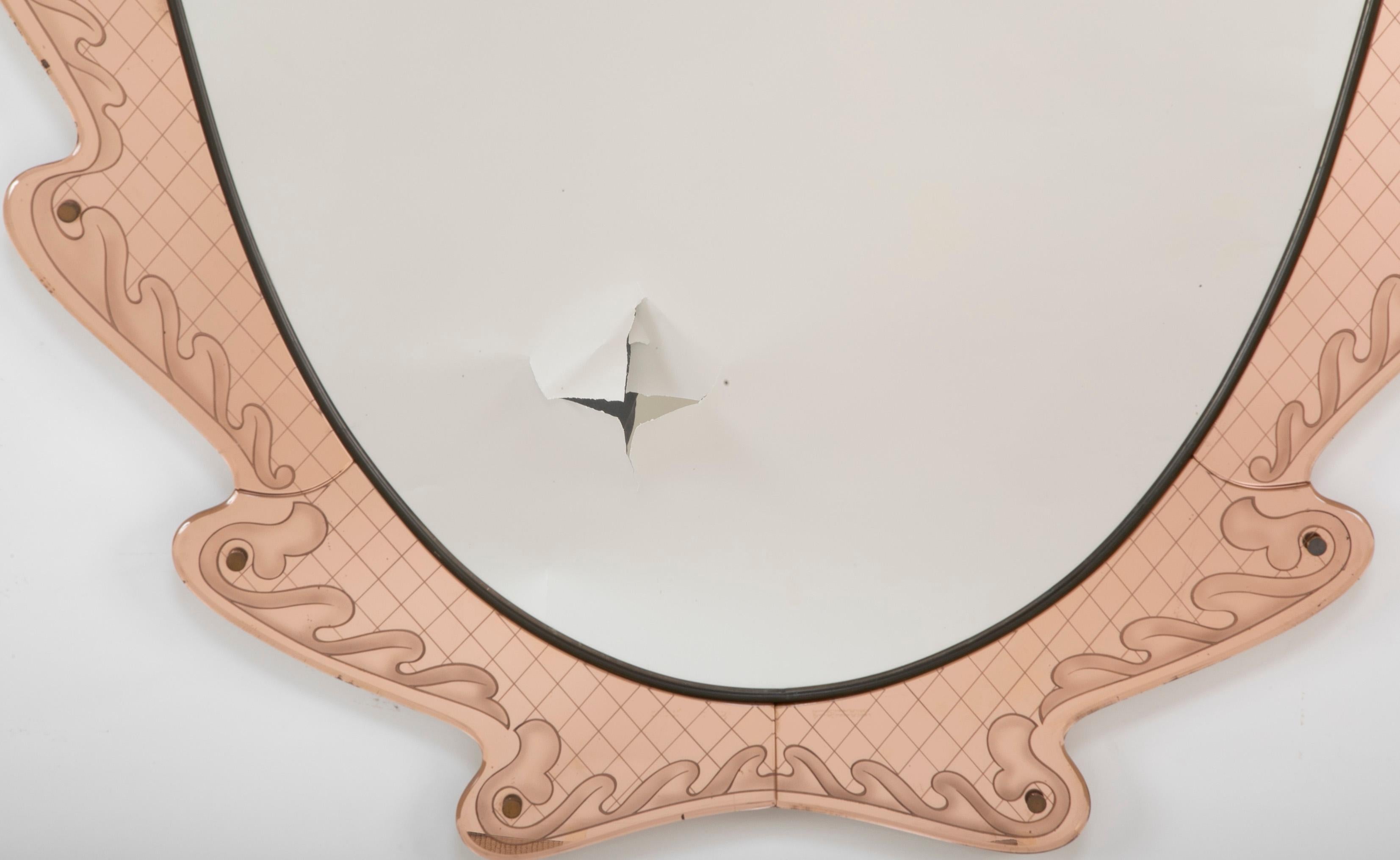A etched pink glass mirror designed by Pietro Cheese for Fontana Arte, circa 1940.
