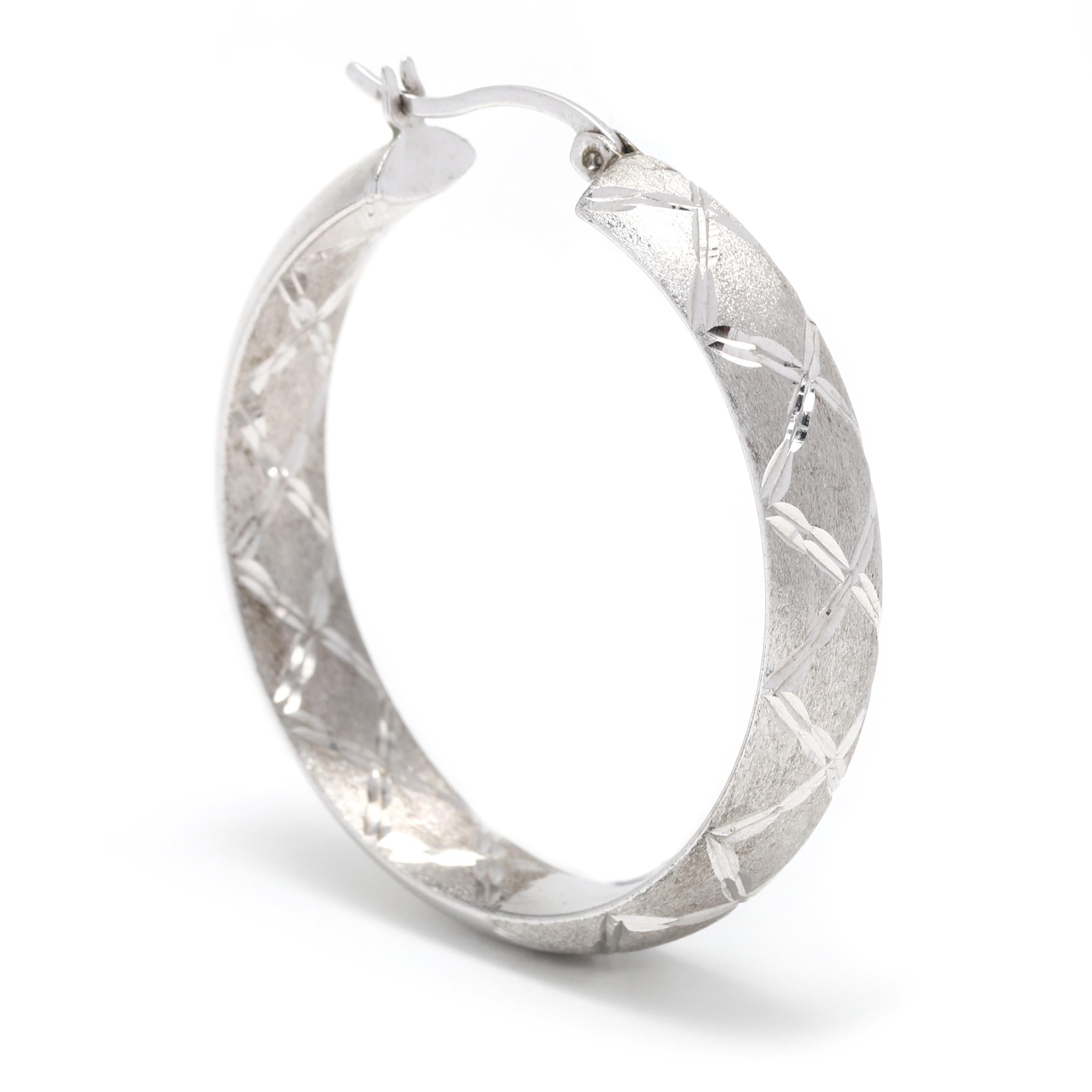 These classic sterling silver hoop earrings feature an etched design and a matte finish. Featuring a diameter of 1.25 inches and a thickness of 1.5mm, these vintage-inspired hoops have a timeless appeal that is sure to be treasured for years to