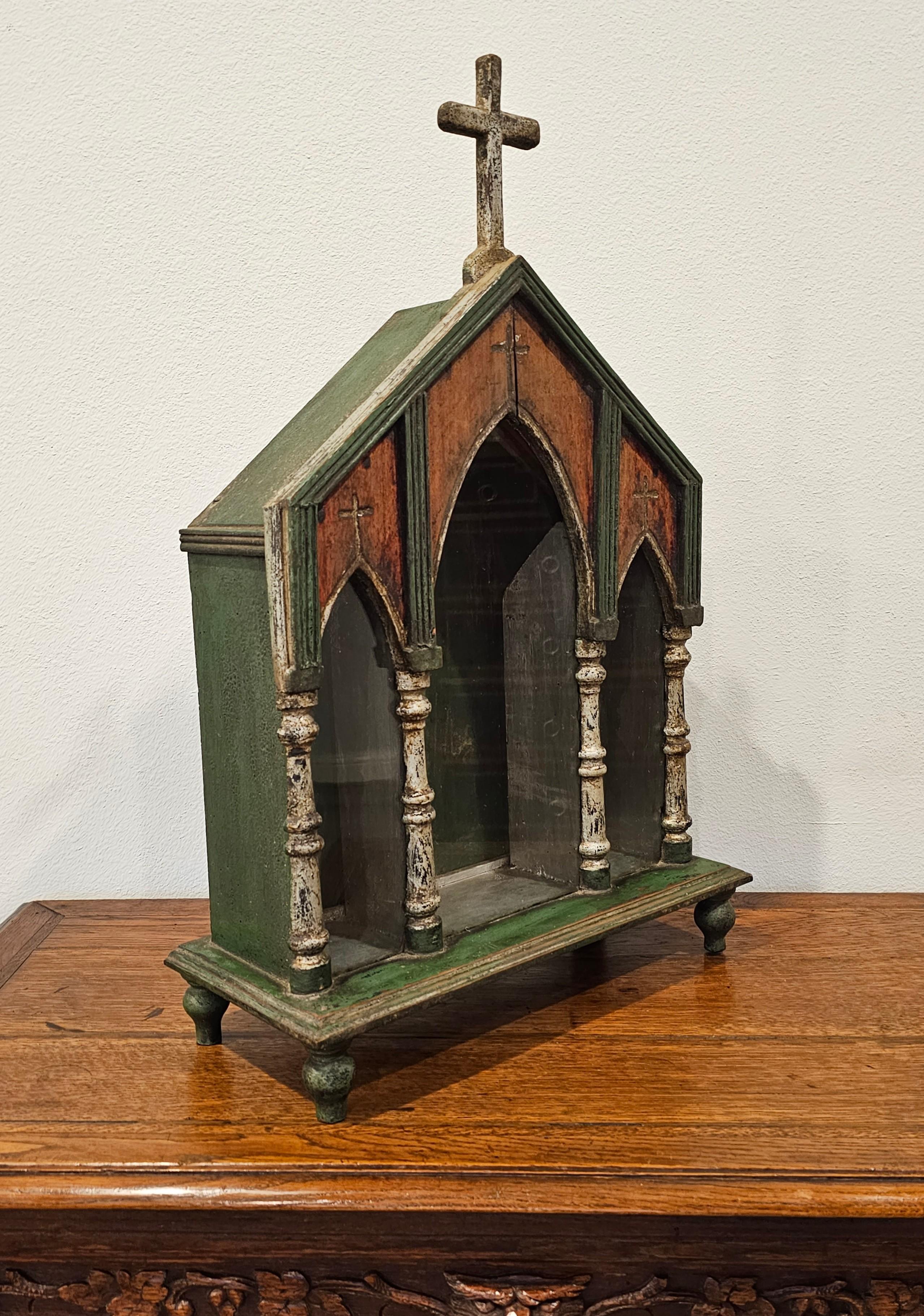 A large one-of-a-kind European antique hand carved polychrome painted silver-gilt religious altar niche with beautifully aged warm distressed patina.

Born in Continental Europe around the turn of the late 19th / early 20th century, rustic
