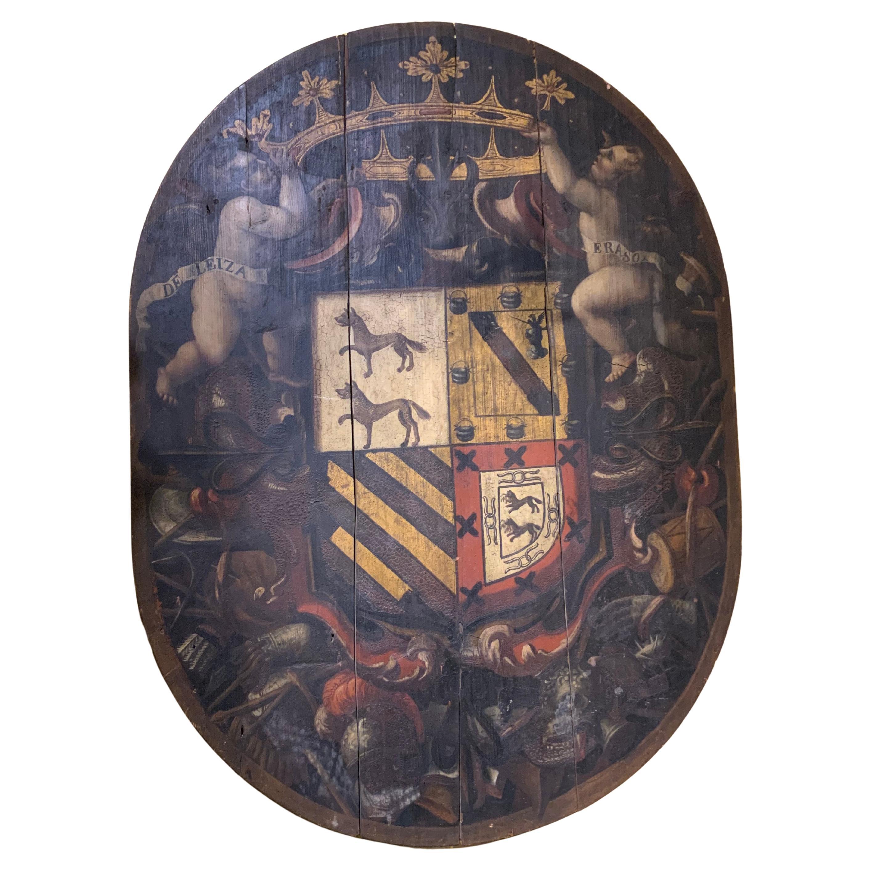 Gran escudo europeo antiguo de madera y policromado