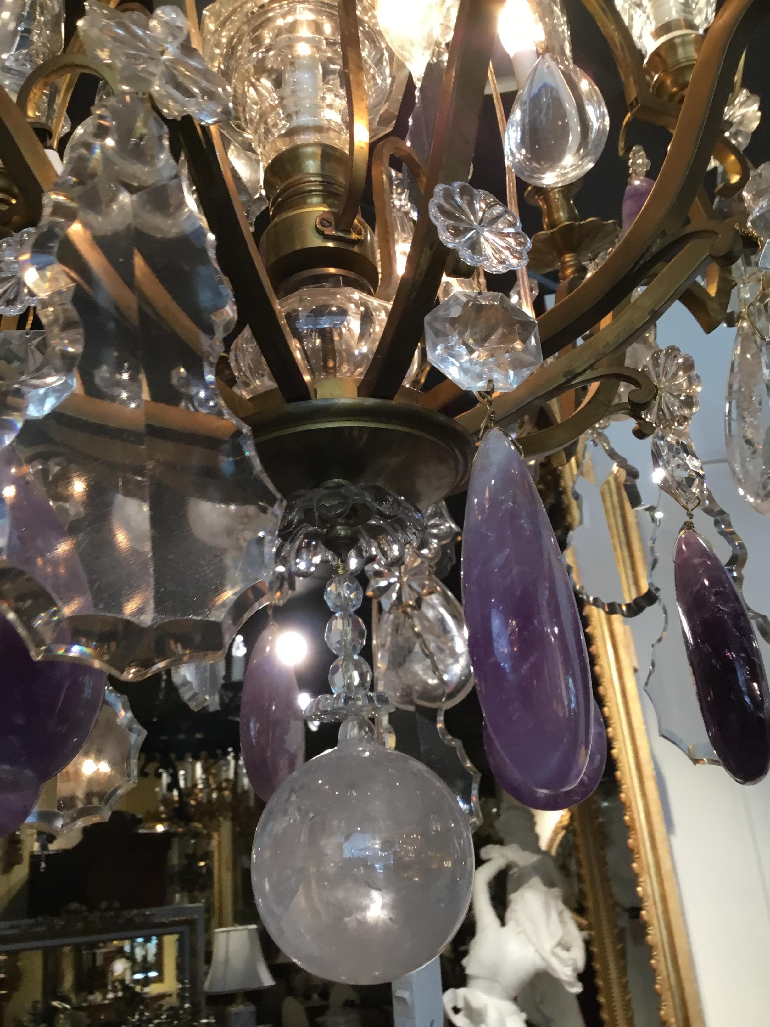 Sixteen-light chandelier having six-light on the exterior rim, three down lights and seven
Lights within the spires. This chandelier has a beautiful rock crystal ball. Beautiful clear shaped crystals,
Abundant rock oval shaped crystals and