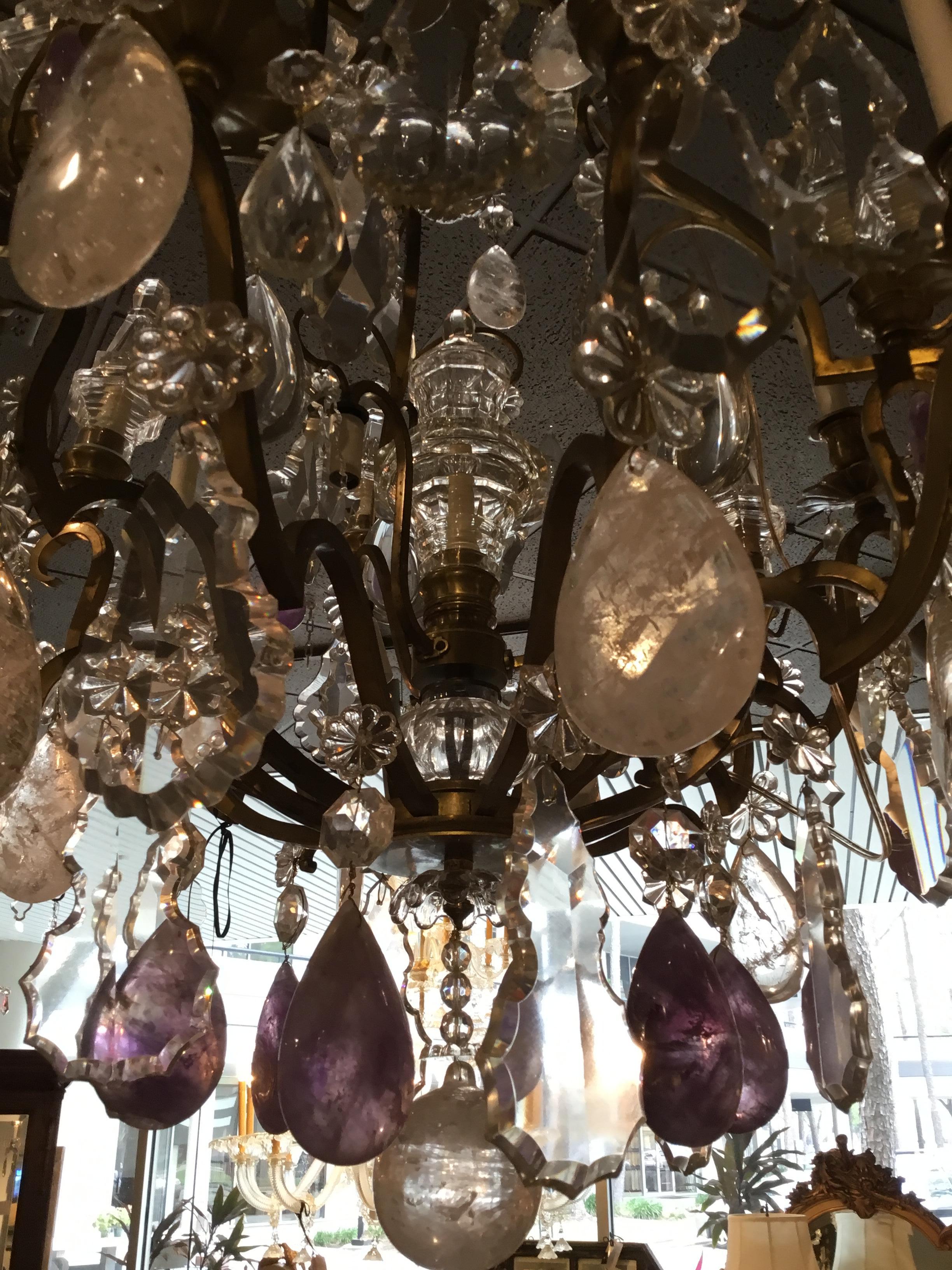 Sixteen-light chandelier having six-light on the exterior rim, three down lights and seven
Lights within the spires. This chandelier has a beautiful rock crystal ball. Beautiful clear shaped crystals,
Abundant rock oval shaped crystals and