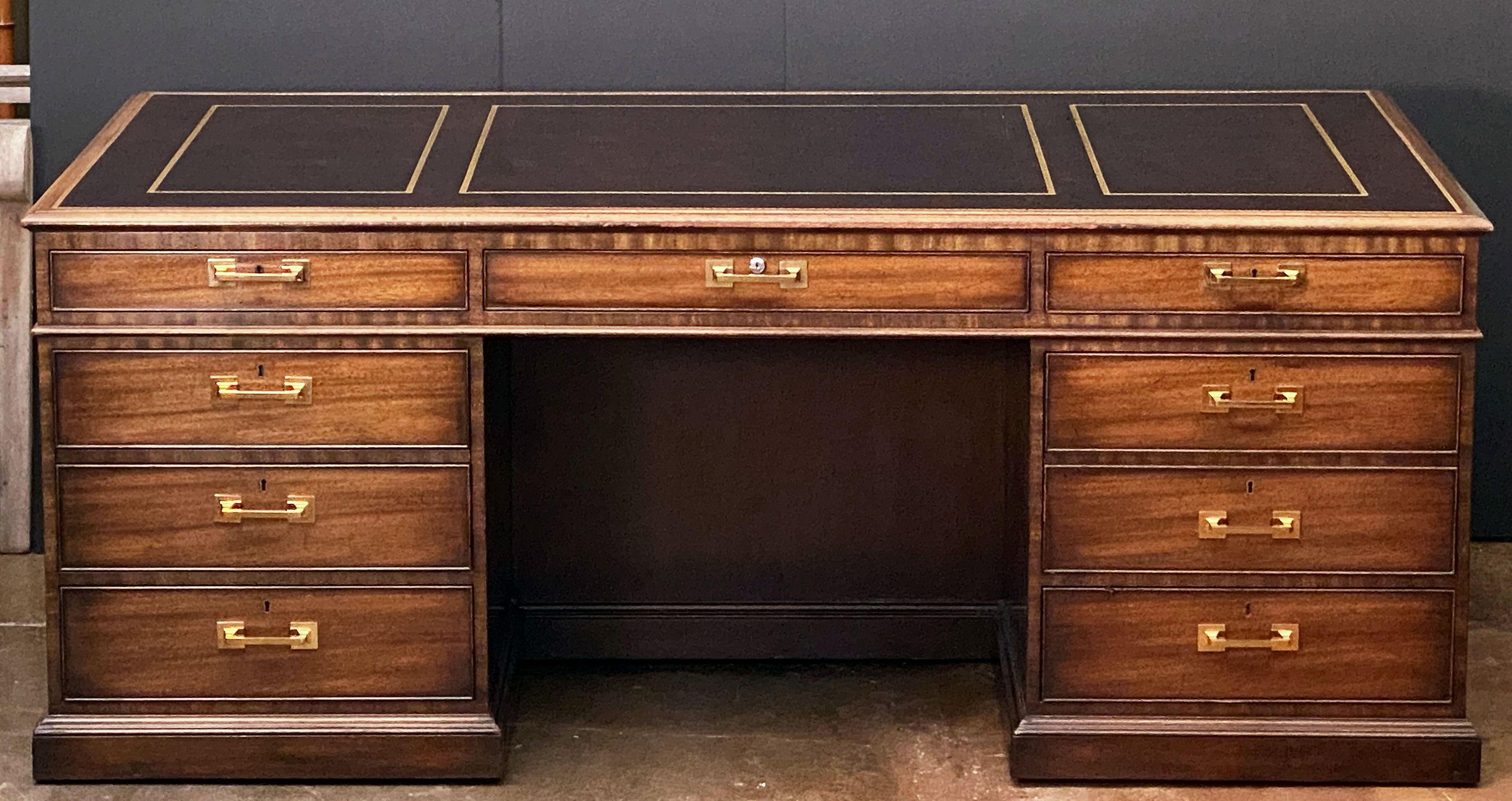 A fine large executive partners pedestal desk featuring an embossed leather top over a frieze of drawers and cabinet drawers, by Kittinger.
With metal Kittinger name plaque in drawer.

Dimensions: H 32 inches x W 79 inches x D 42 1/4 inches.