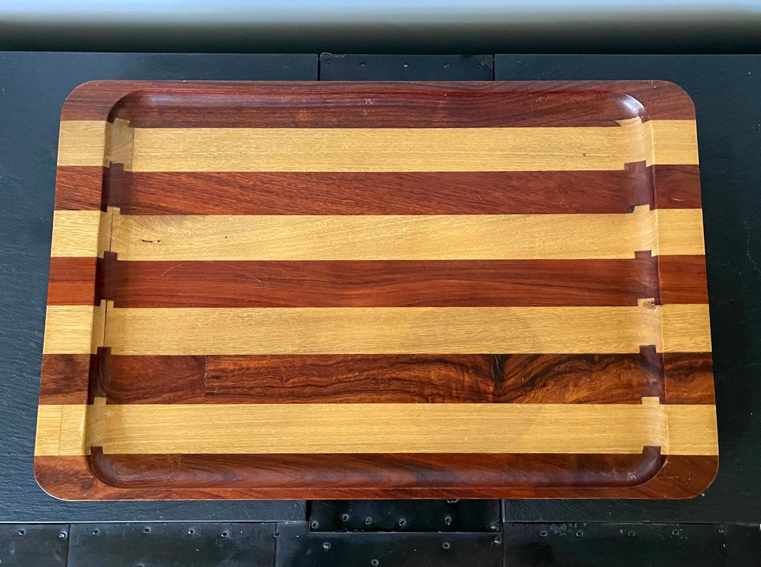 A large rectangular wood tray designed by Don Shoemaker and handcrafted by SEN~AL, S.A. Mexico circa 1950. Using exotic local wood in Mexico such as Cocobolo, Shoemaker designed and manufactured his signature collection of furniture as well as