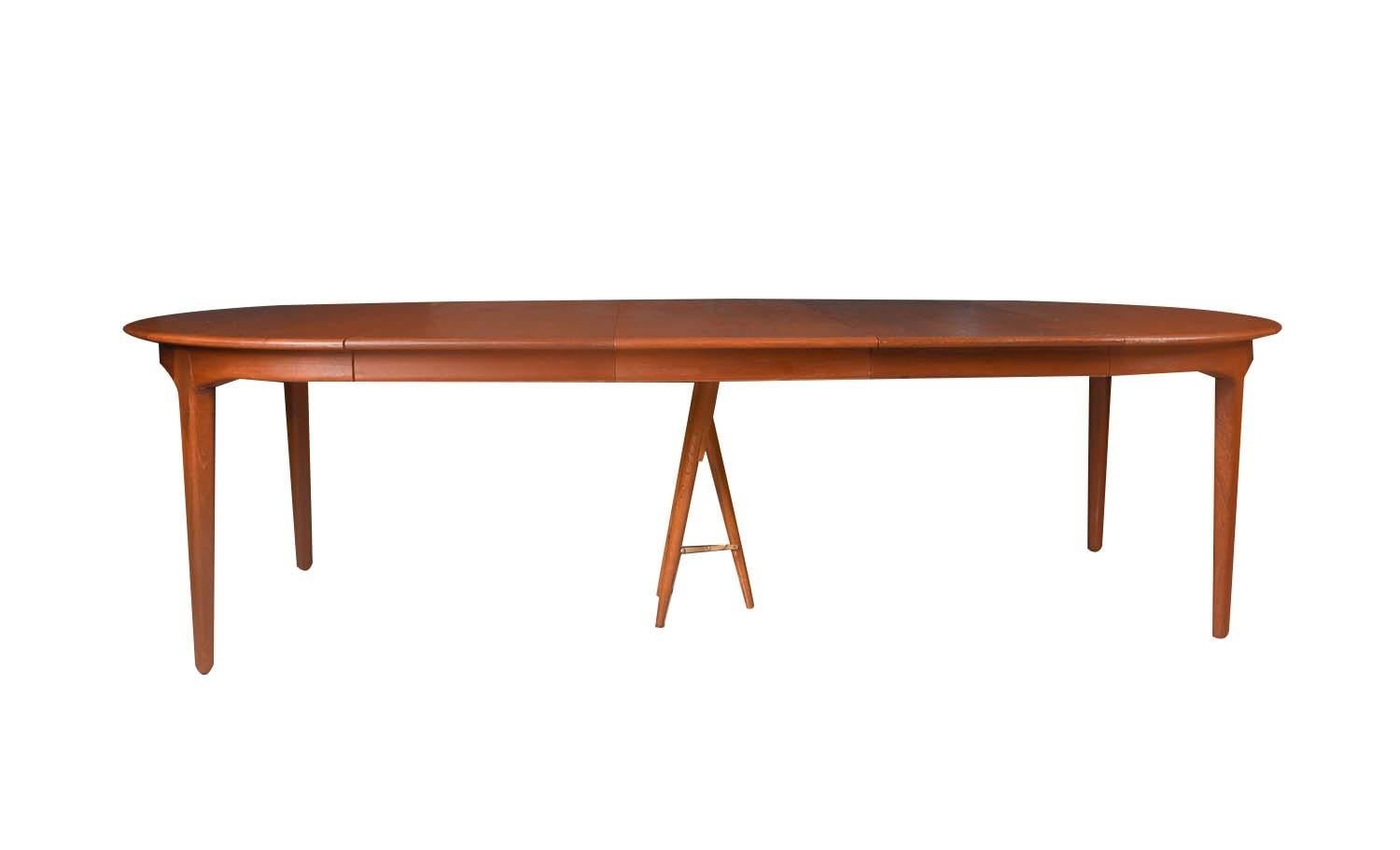 Scandinavian Modern Large extendable Danish teak dining table model 62 by Henning Kjaernulf 1960. For Sale