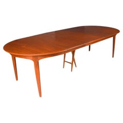 Large extendable Danish teak dining table model 62 by Henning Kjaernulf 1960.