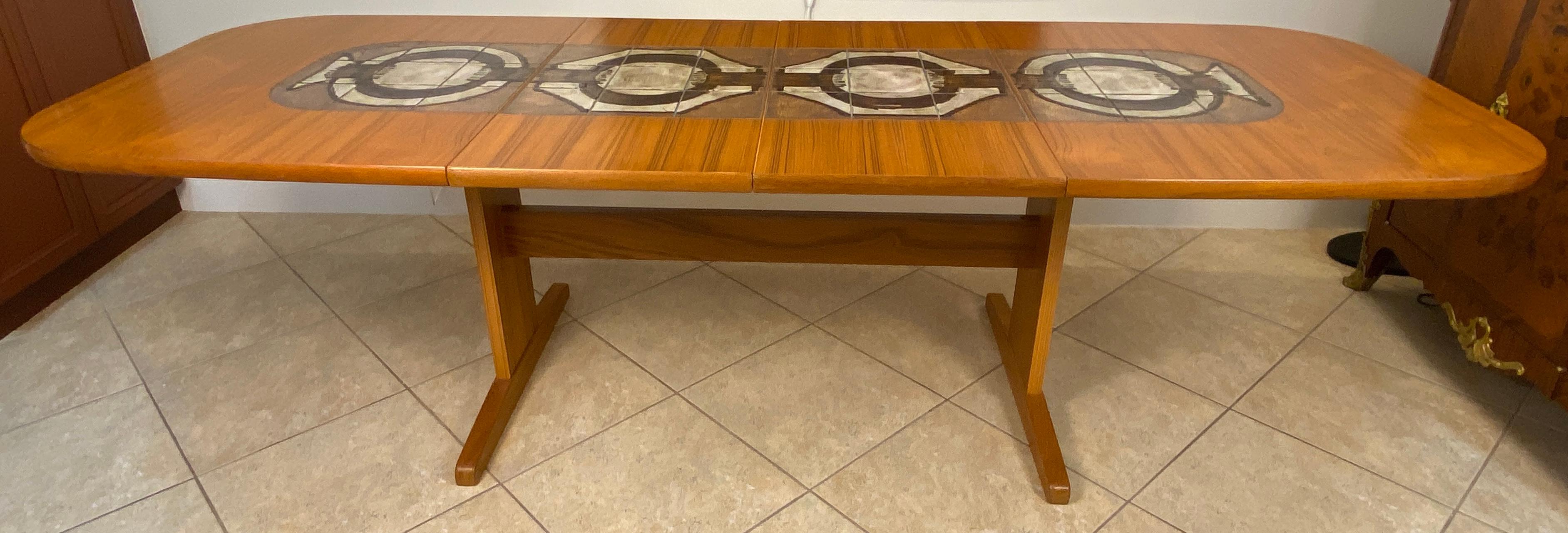 Poul Poulsen Large Mid-Century Extendable Danish Dining Table,  
Teak Dining Table with Tile Inlay by Poul H. Poulsen, Denmark, 1970s
Extendable Danish MCM Teak Dining Table. 

Poul H. Poulsen Danish Modern Dining Table with Hand-Painted Ceramic