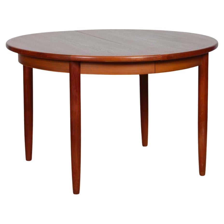 Large extendable round teak dining table, 1960