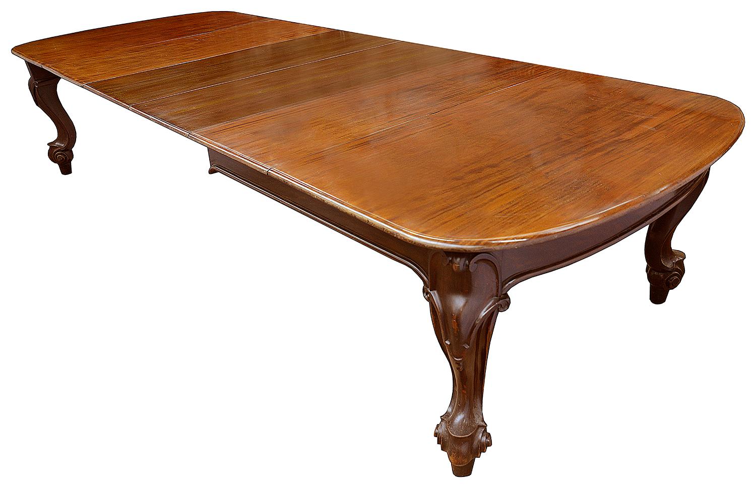 A large and impressive 19th century Victorian period mahogany extending ding table, with its five original leaves, raised on well carved cabriole legs with a central turned leg support.
Seats maximum 14
Fully adjustable down to seating four.