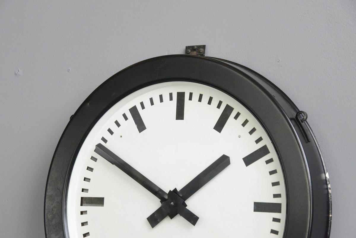 Large factory clock by Bohmeyer, circa 1940s

- Steel casing
- Glass face
- Steel dial
- New quartz motors 
- Takes 1x AA battery
- Made by Bohmeyer, Halle
- German, 1940s
- Measures: 50cm wide x 8cm deep

Condition report

Fully