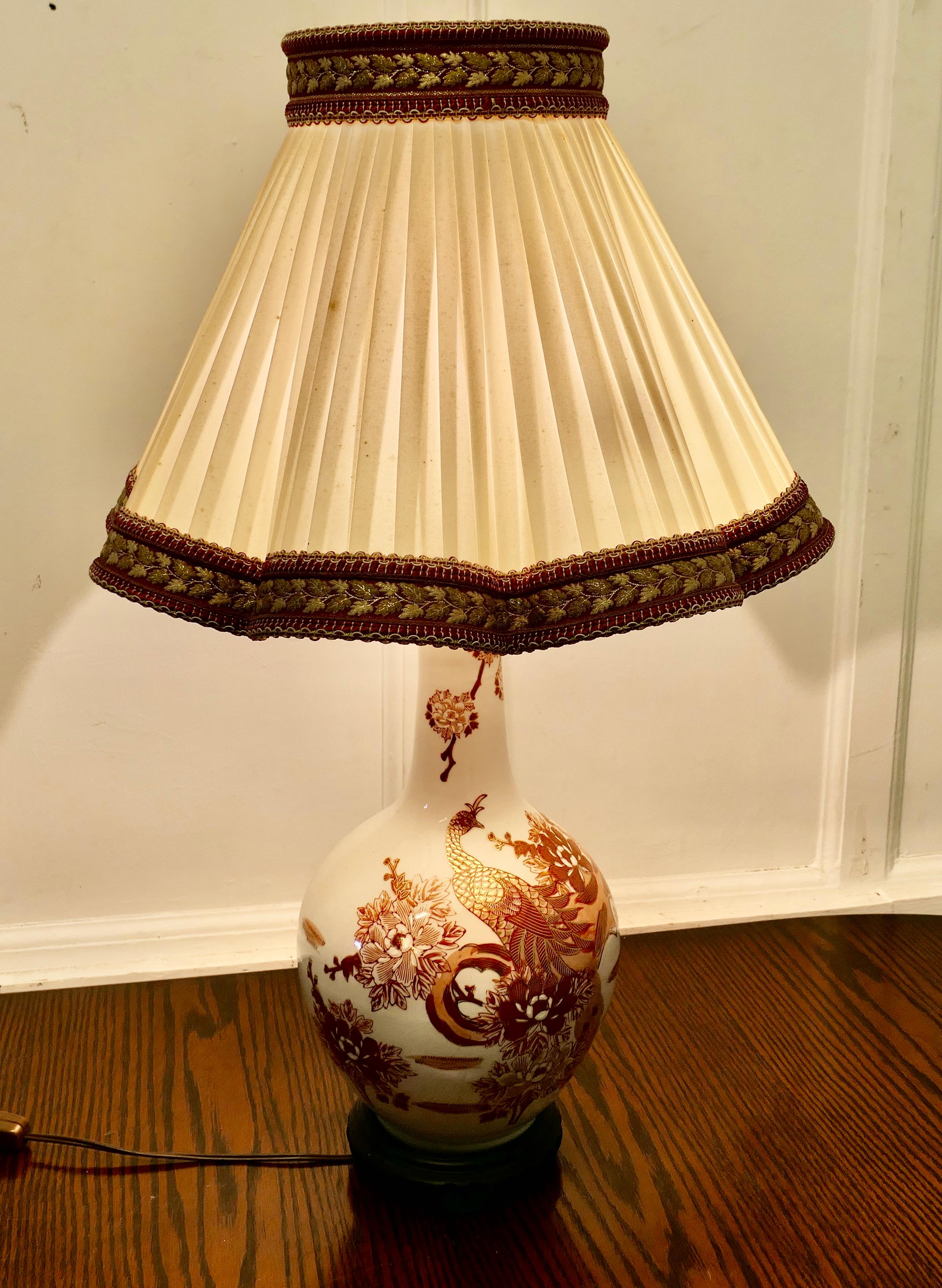 Large Famille Rose Dragon Vase Lamp, Classic Oriental Chintz


A Lovely Vintage piece dates back to the 20th Century, it come with a matching pleated shade
The lamp is decorated in a Famille Rose and Gilt Dragon design 
The lamp is in good condition