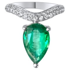 Large Fancy 2.58 Pear shaped emerald solitaire and brilliant cut diamonds wave r