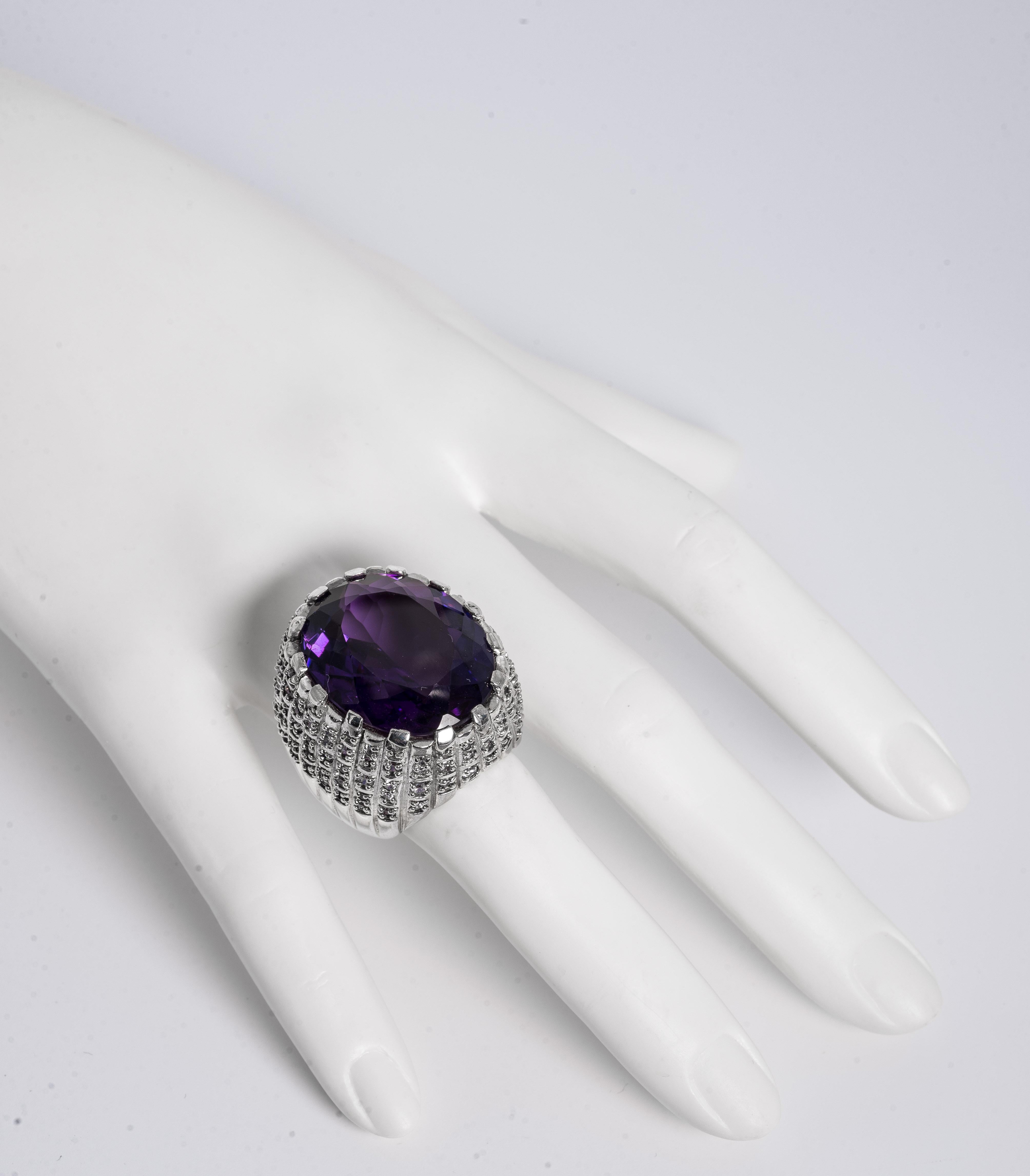 Large Real Amethyst Set In A  CZ Pave Sterling Chunky Ring
This is a big ring statement ring!  measures 1 1/4inch diameter over half an inch off the the finger size 7.5 !