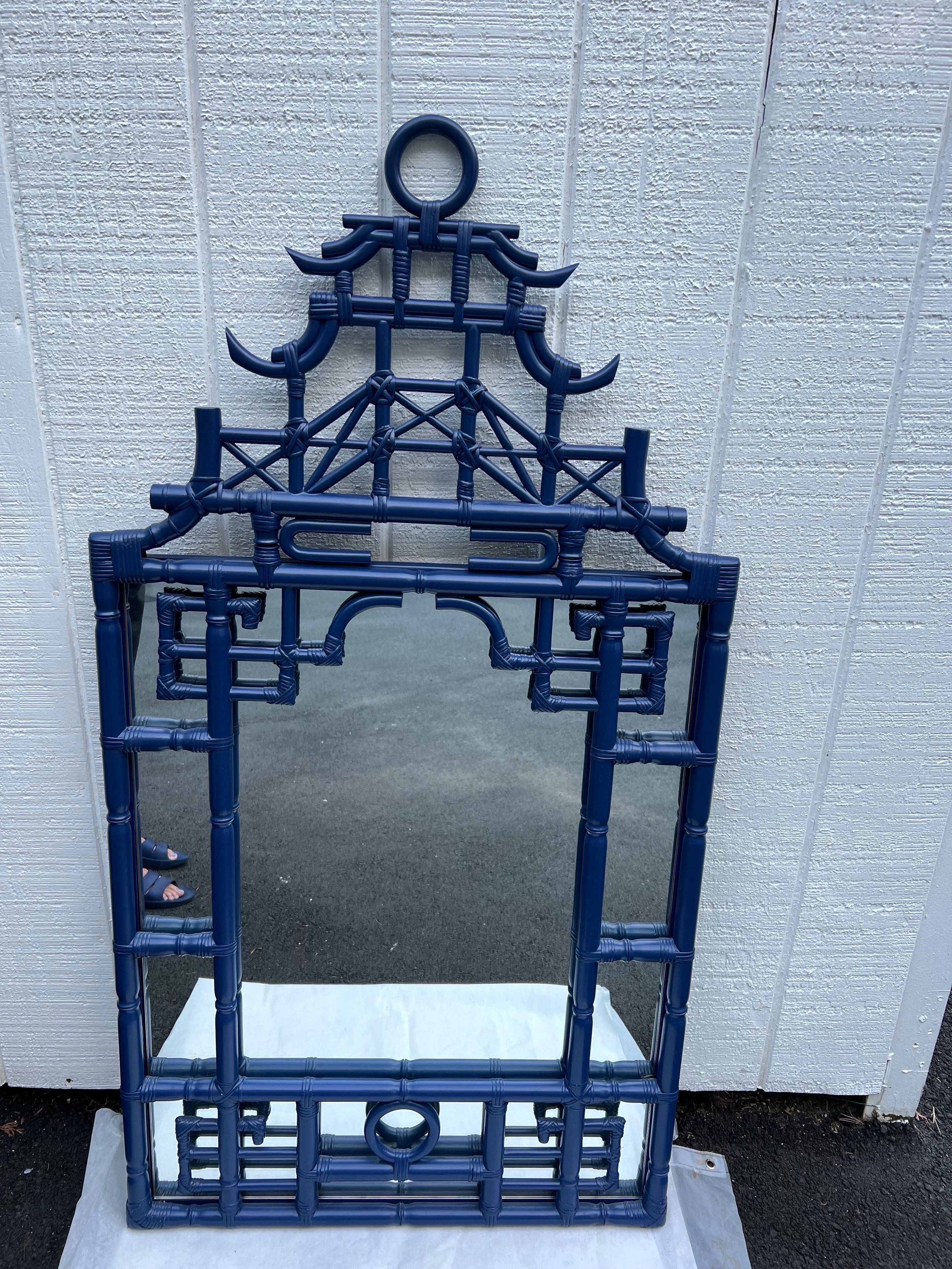 Large Faux Bamboo Pagoda Mirror in Cobalt Blue. This large Palm Beach Style mirror is the ultimate statement piece to embellish any hallway or dining room. Layered tiers of Pagoda roof shapes . This would fit in perfectly at the legendary Colony