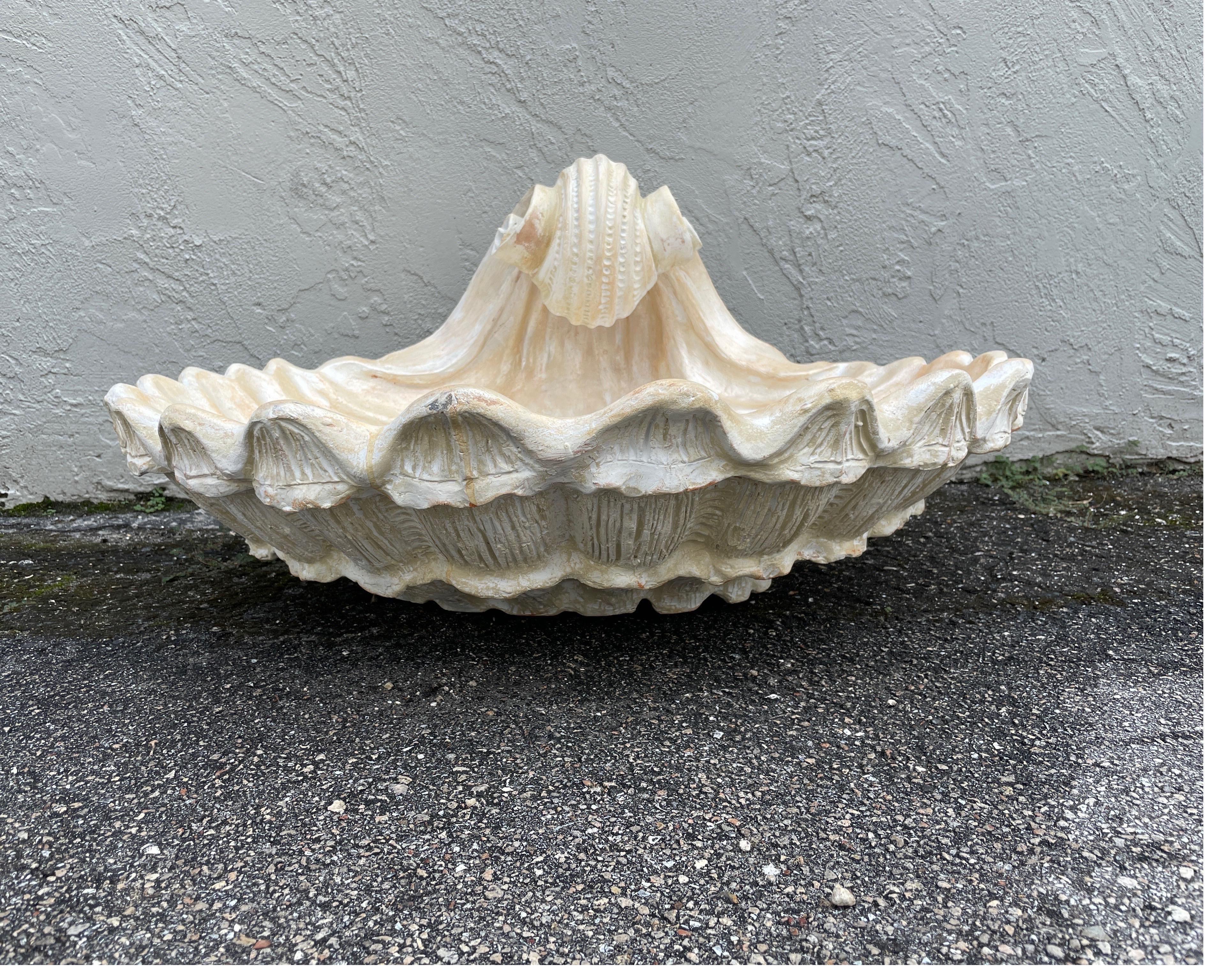 Large Terra Cotta faux painted shell. Would make a fabulous centerpiece.