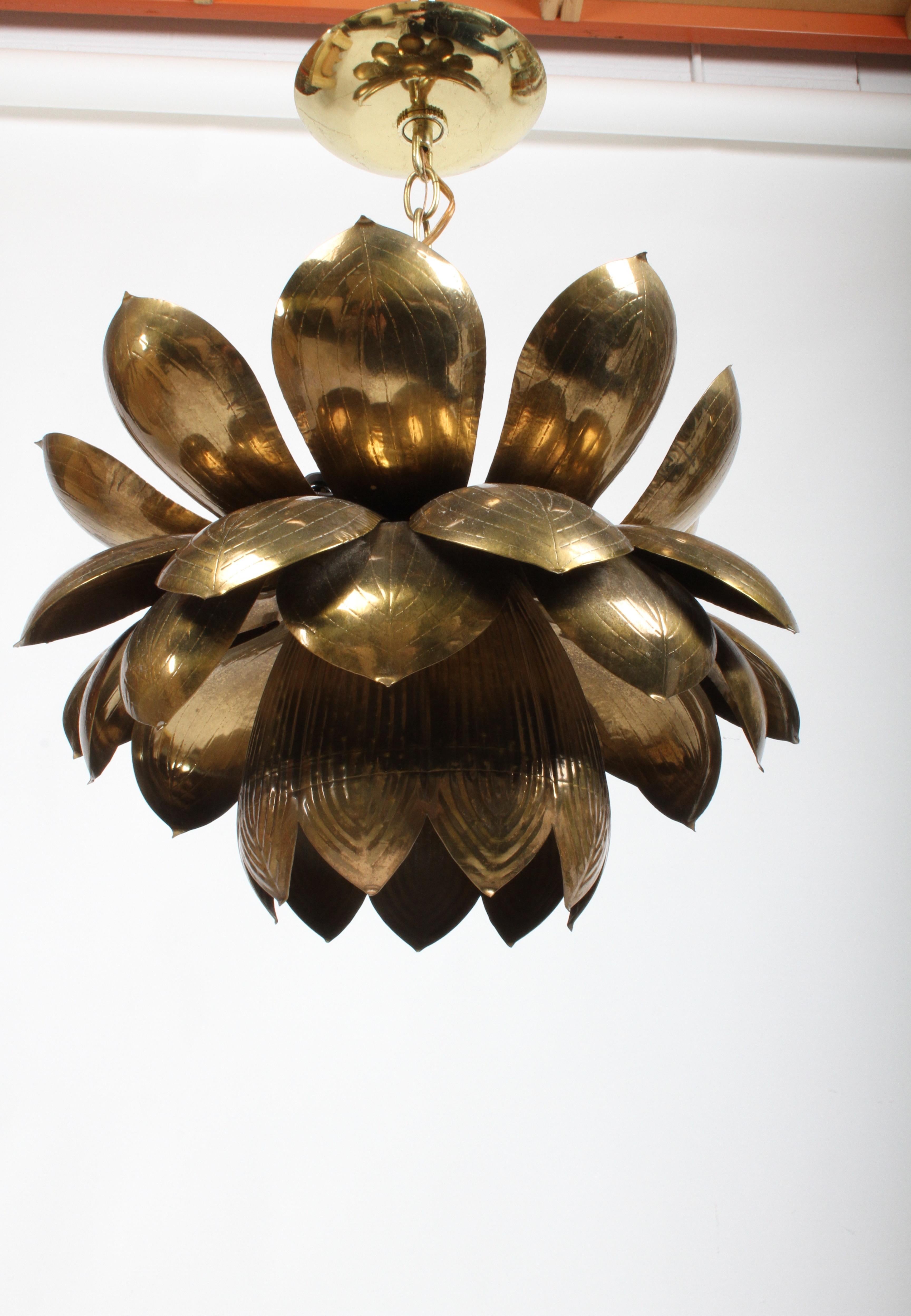 This is the large version of the Feldman Lighting Company's brass lotus chandelier, original brass patina. Three small sockets at top. The lower light uses 1 - 60 watt max 
