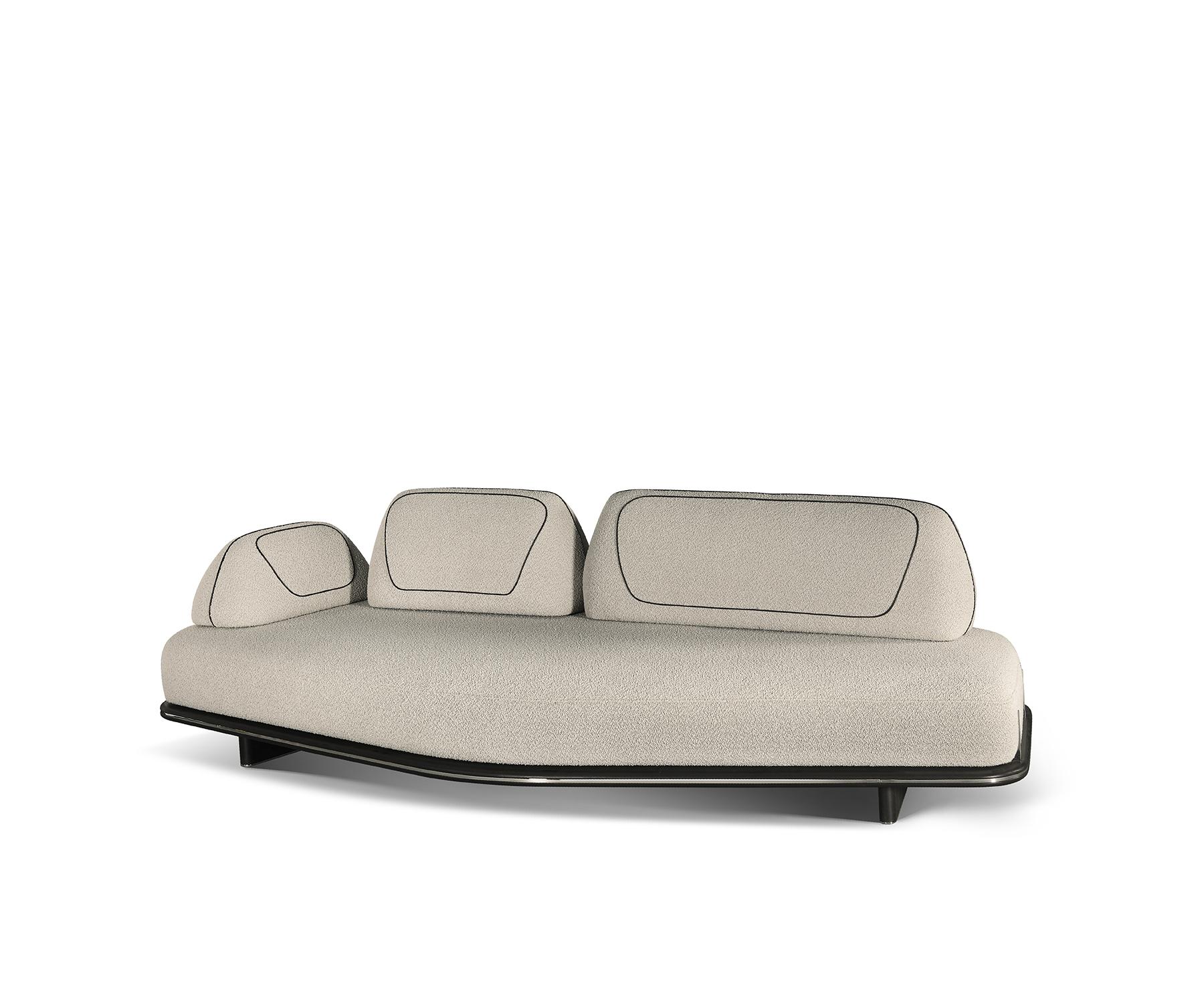 The Field sofa captures the beauty of natural forms, inspired by the Dialogue collection’s exploration of organic shapes and landscapes.

Its textured upholstery pairs elegantly with leather accents, resting on a sleek, low-profile metal base