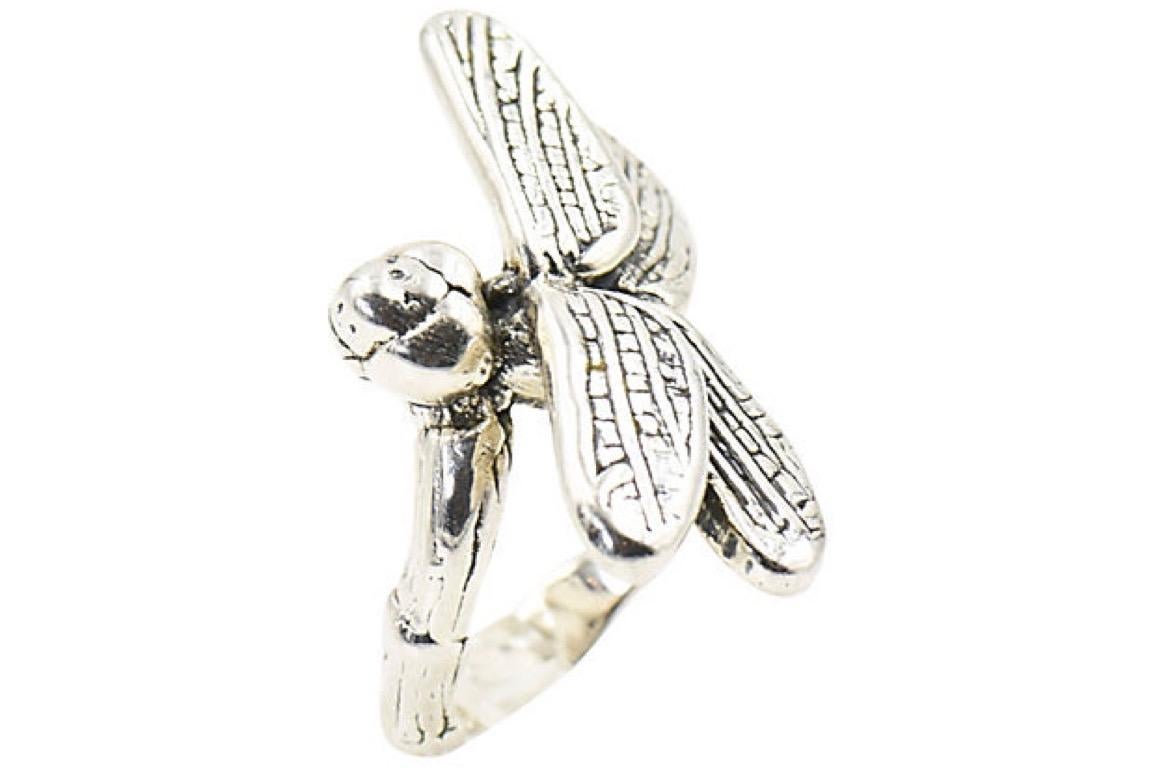 Highly stylized three dimensional dragonfly sterling silver ring that sits on a sterling silver bamboo design bank. Marked NF 925 Thailand. While sitting on your hand it is over 1