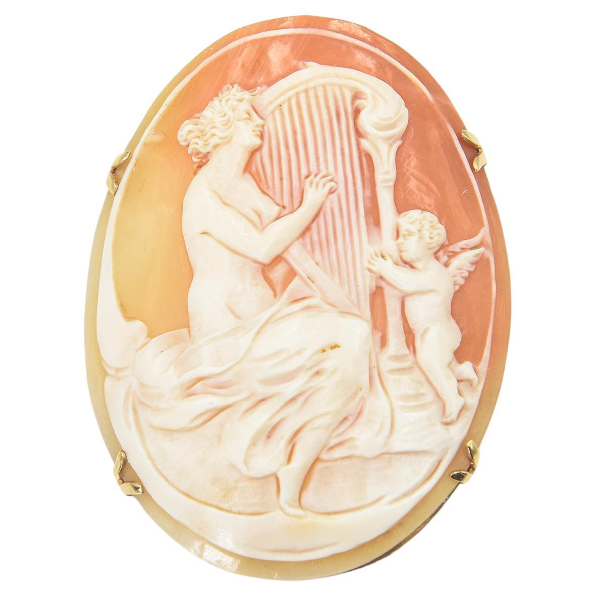 Large Figural Shell Cameo of Nude Woman Playing the Harp with Cupid Gold Brooch For Sale