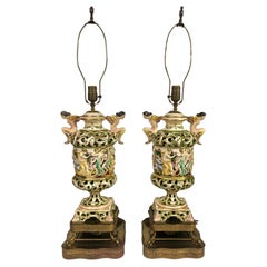 Large figurative Capodimonte ceramic lamps with decorative bacchanal scene
