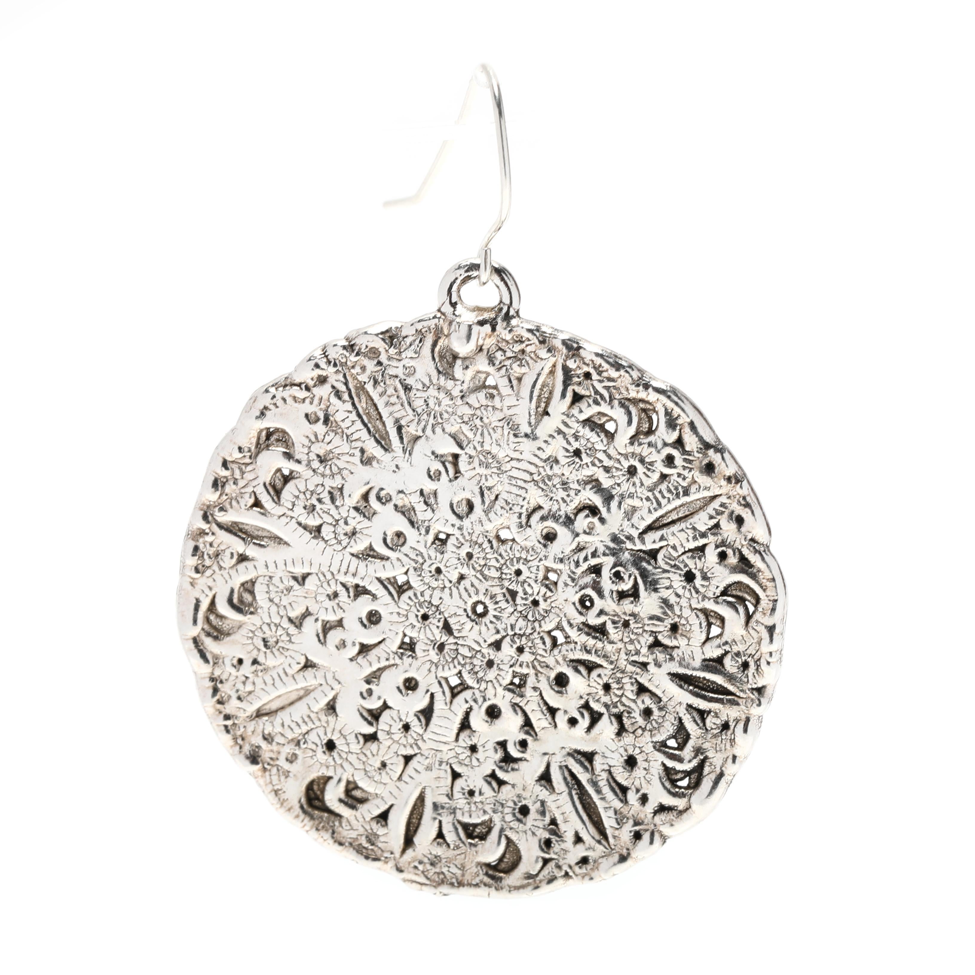 These beautiful filigree lace circle dangle earrings are perfect for any occasion. Crafted from sterling silver, the organic lace circle shape measures 2 1/8 inches in length. The flat dangle design is timeless and elegant for any look. Whether