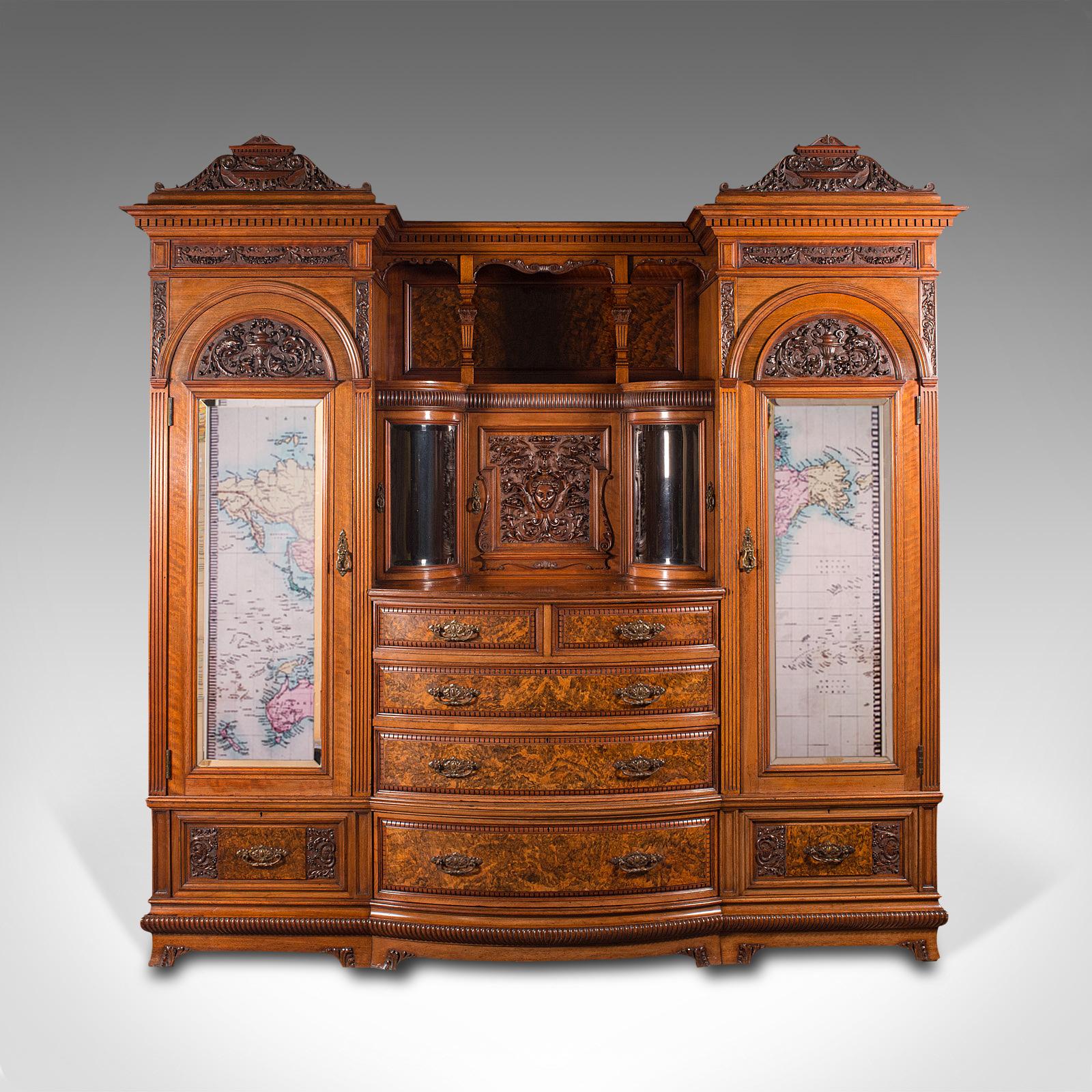This is a large fine antique gentleman's wardrobe compactum. An English, walnut bedroom cabinet by Gillow and Co of Lancaster, dating to the Victorian period, circa 1880.

A grand wardrobe of the first order - a testament to Gillows'
