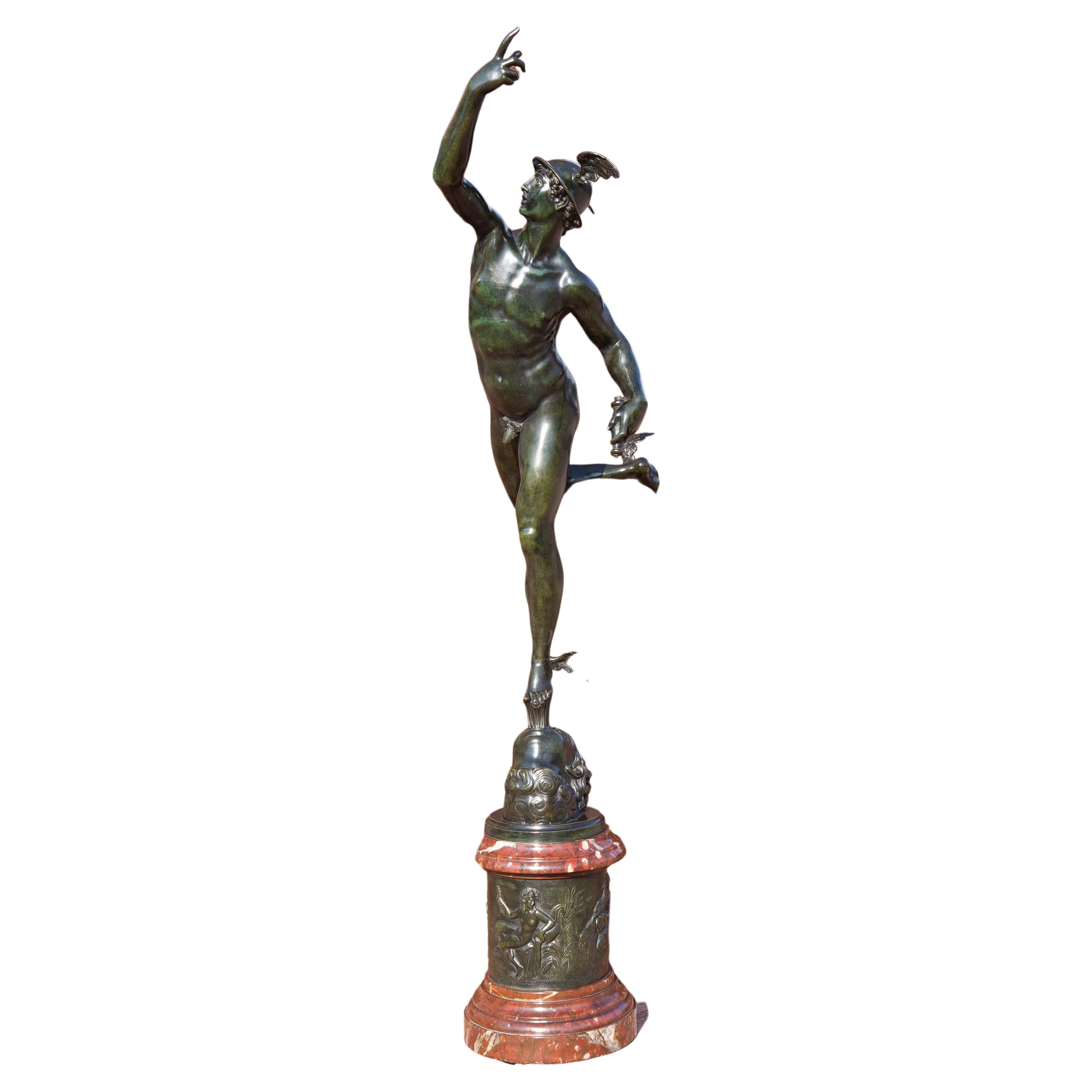 Fine Grand Tour bronze sculpture of mercury flying on the wind after Giambologna. Polished rouge marble and bronze attached base. Green marble pedestal. Inscribed Jean de Bologne ( Giambologna). Over all height 8'7