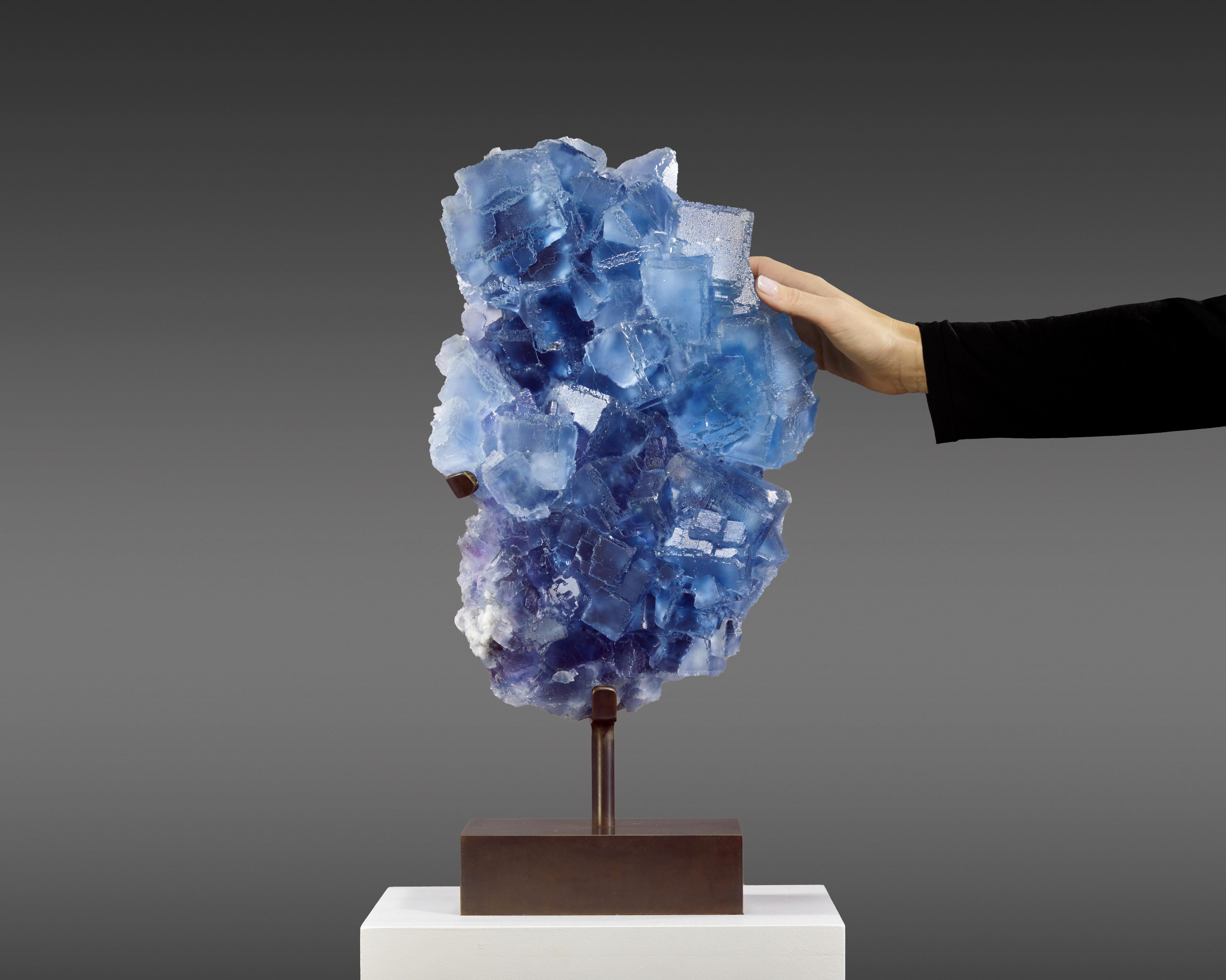Presented is an exceptional specimen of blue-purple Fluorite,
with a serene light blue hue that evokes the clear sky of a
summer’s day. Originating from the esteemed La Viesca mine in
Asturias, Spain, this piece is graced with enchanting
