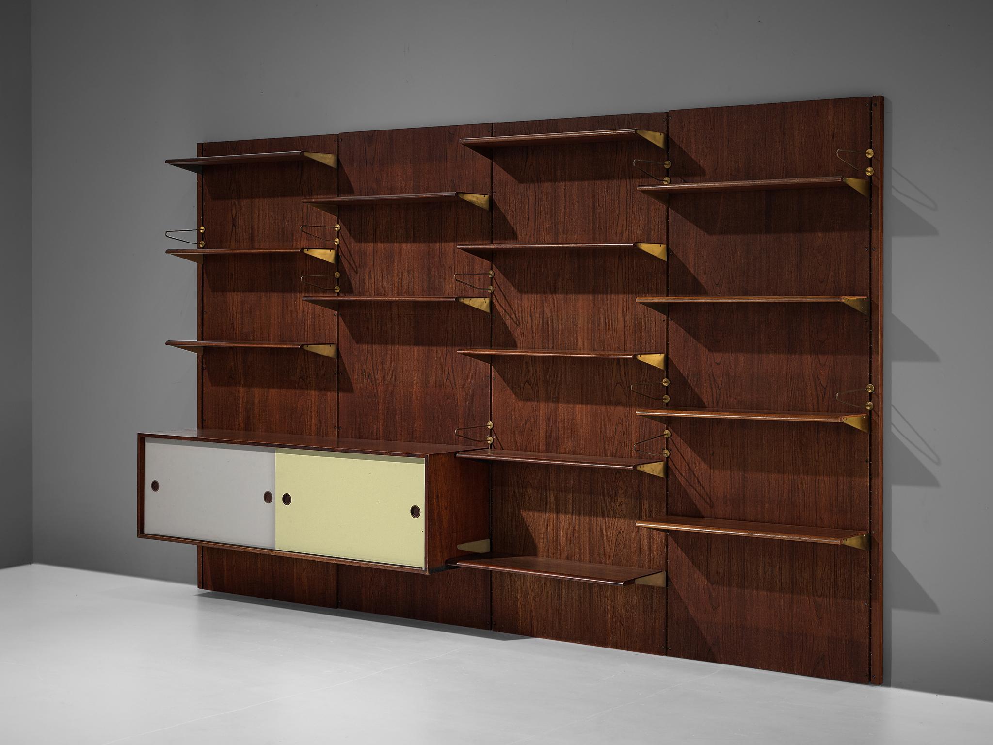 Finn Juhl for Bovirke, wall unit, model 'BO71', teak, pine, lacquered wood, brass, Denmark, 1950s

This bookcase is a design by the Danish master Finn Juhl for Bovirke in the 1950s. The composition is based on four columns executed in teak, each