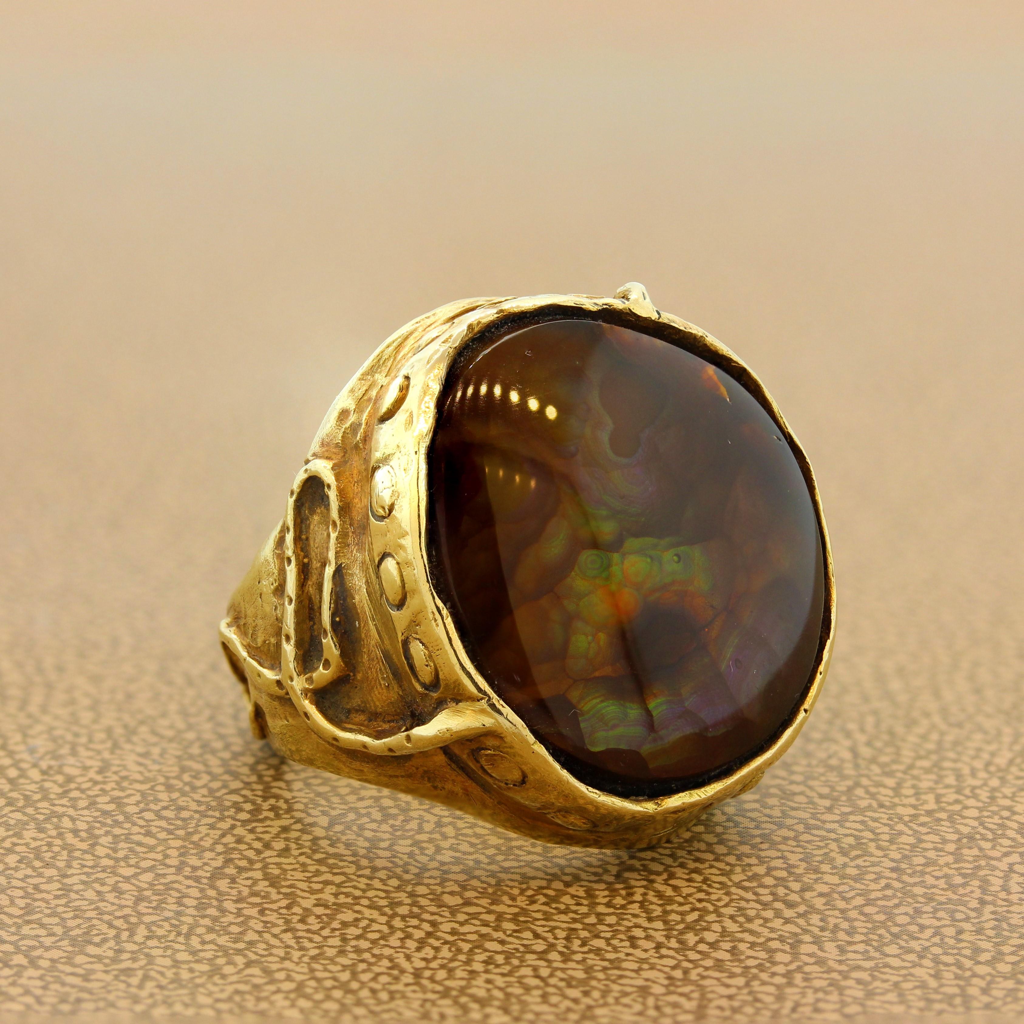This handmade ring features a mystical fire agate that is bezel set in an 18K yellow gold setting. The filigree on the gold matches the medieval theme of this one of a kind ring. Unisex, can be worn by men and women.

Ring Size 7.5 (Sizable)
