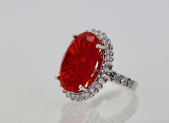 Large Fire Opal 13.0 Carat faceted with Diamond 1.25 Carat Surround