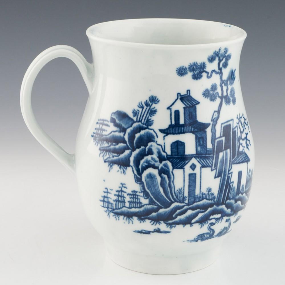 Large First Period Worcester Plantation Pattern Mug, circa 1765

Date: c.1765
Period: George III
Marks: None
Origin: Worcester, England
Colour: Blue and white
Pattern: Plantation
Features: Baluster shaped body and strap handle
Dimensions: H
