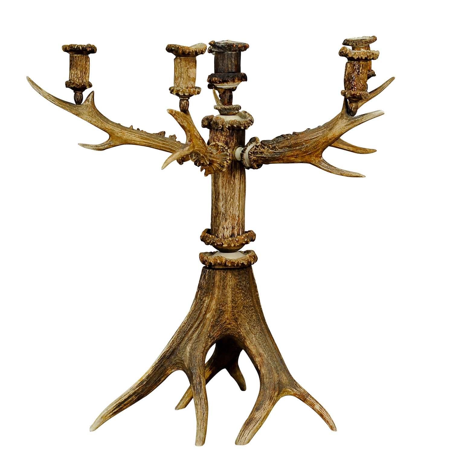 Large five armed cabin Decor Antler Candelabra 1880

A very rare and great five-armed rustic candelabra with six candle spouts. Made of original stag and deer antlers, spouts, turned antler rouses and carved decorations. It was manufactured in