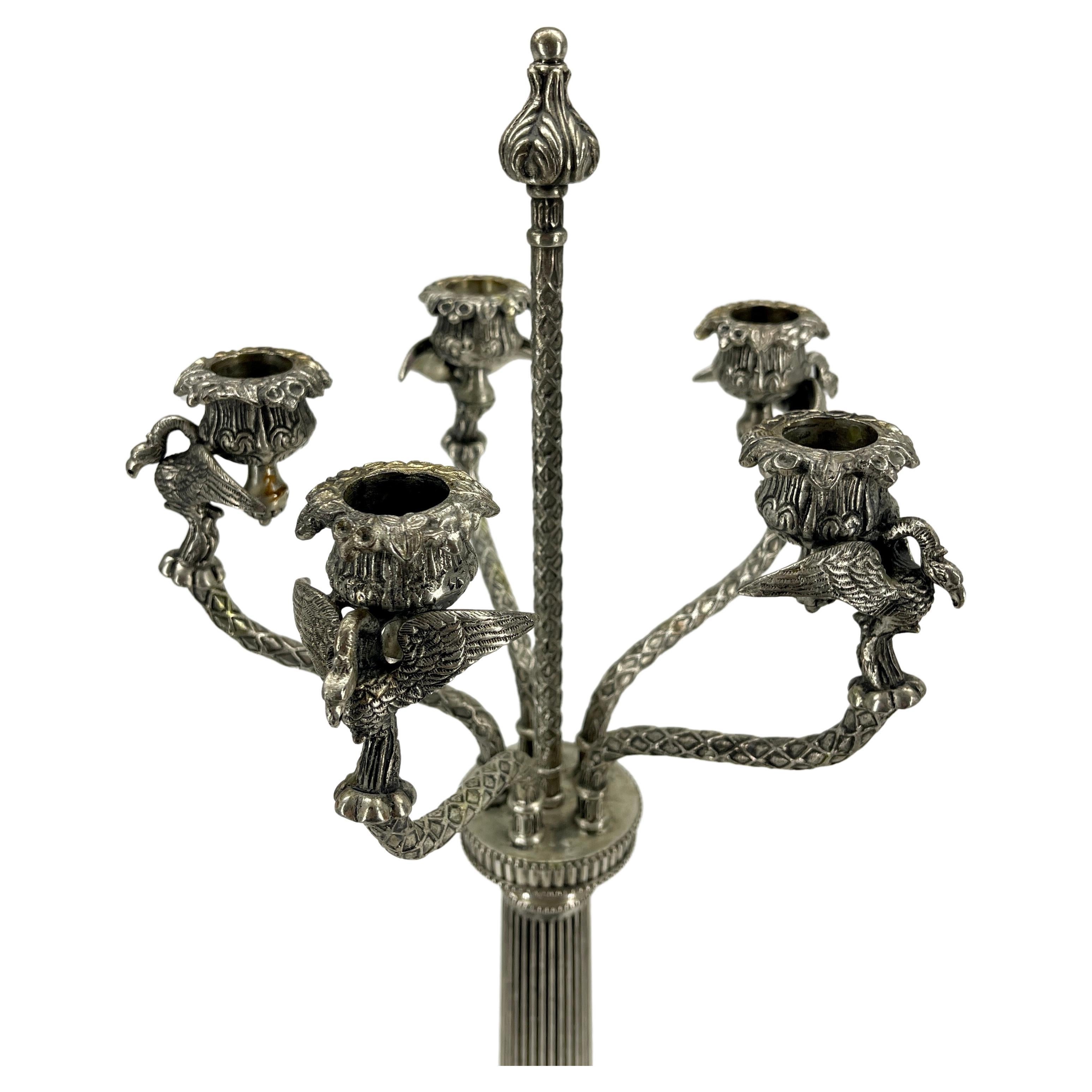 Single tall candelabra in silver plate with five candlestick arms each with Griffon Vultures.
The Gyps is a genus of Old World vultures that was proposed by Marie Jules César Savigny in 1809. Its members are sometimes known as griffon vultures.