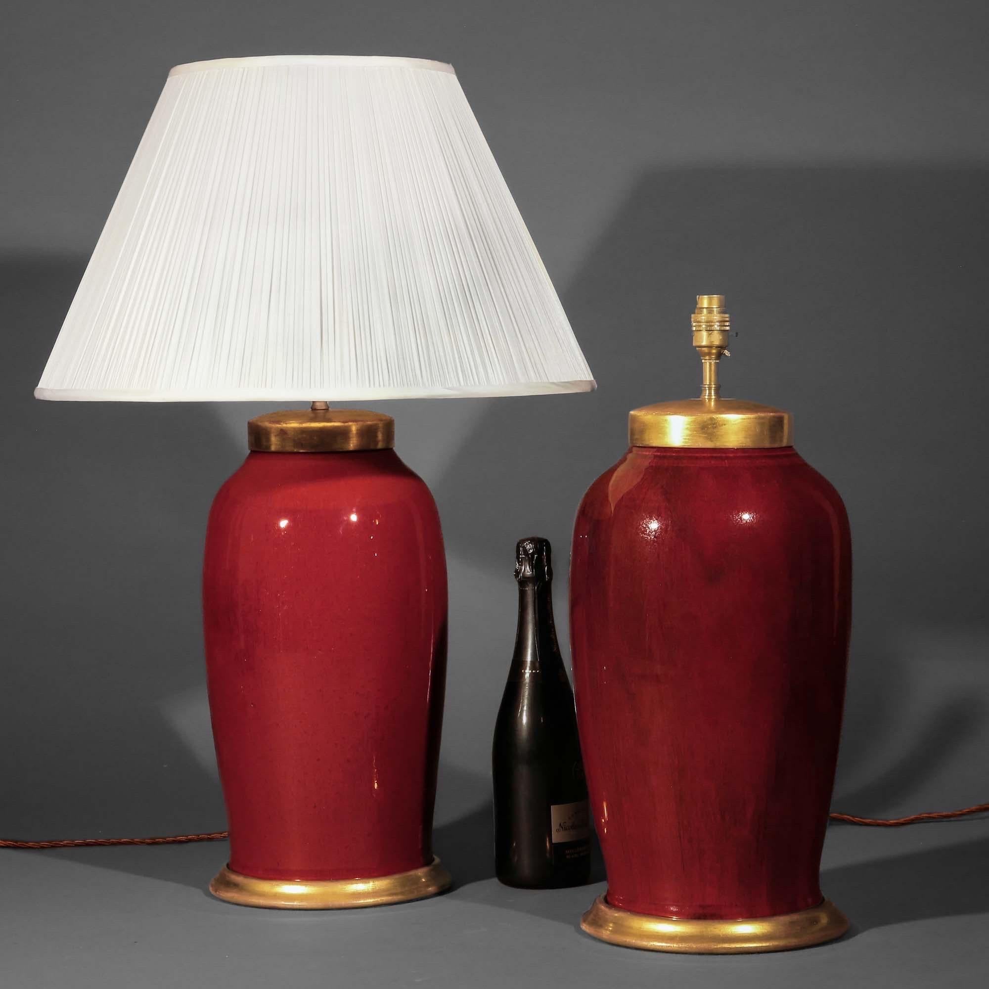 A superb pair of flambé glazed lamps of grand scale on giltwood bases. Mid/late 20th century. 

Why we like them

Richly coloured and of grand scale, these versatile lamps will complement traditional, contemporary or eclectic interiors. The flambé